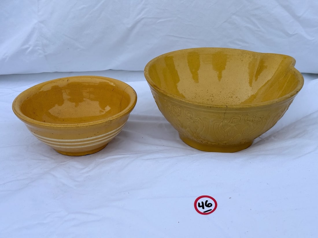 2 Yellow Ware Bowls: 1 Embossed w/pouring spout; largest is 11" diameter