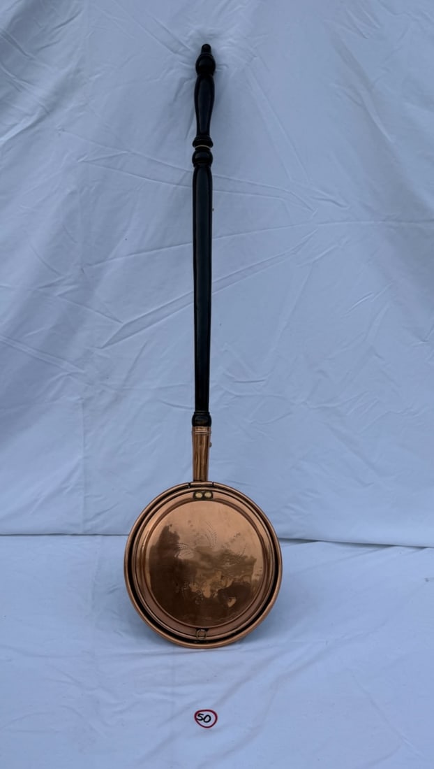 Antique Bedwarmer: Copper w/brass; an etched pattern on cover; wooden handle; overall length 40"