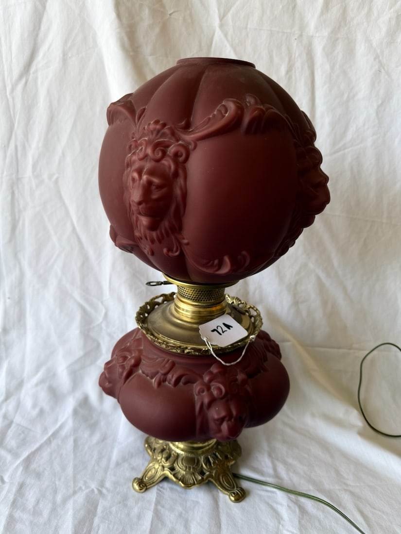 Nice GWTW Lamp: Matching base & shade; embossed lion's head on red satin glass; 23" tall