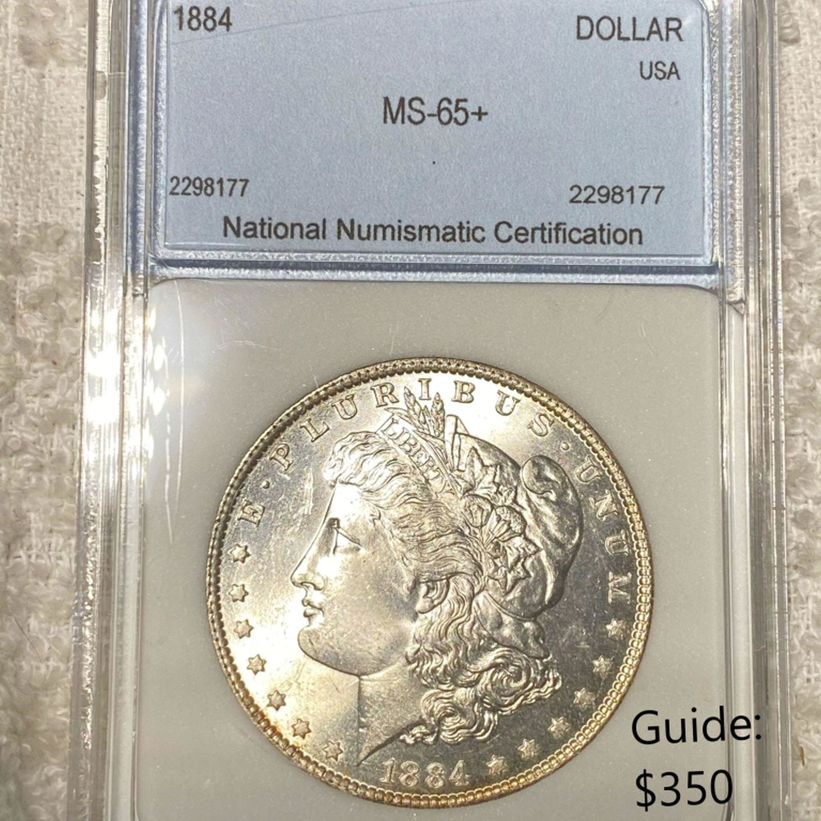 1884 Morgan Silver Dollar NNC - MS65+ (1 of 2)