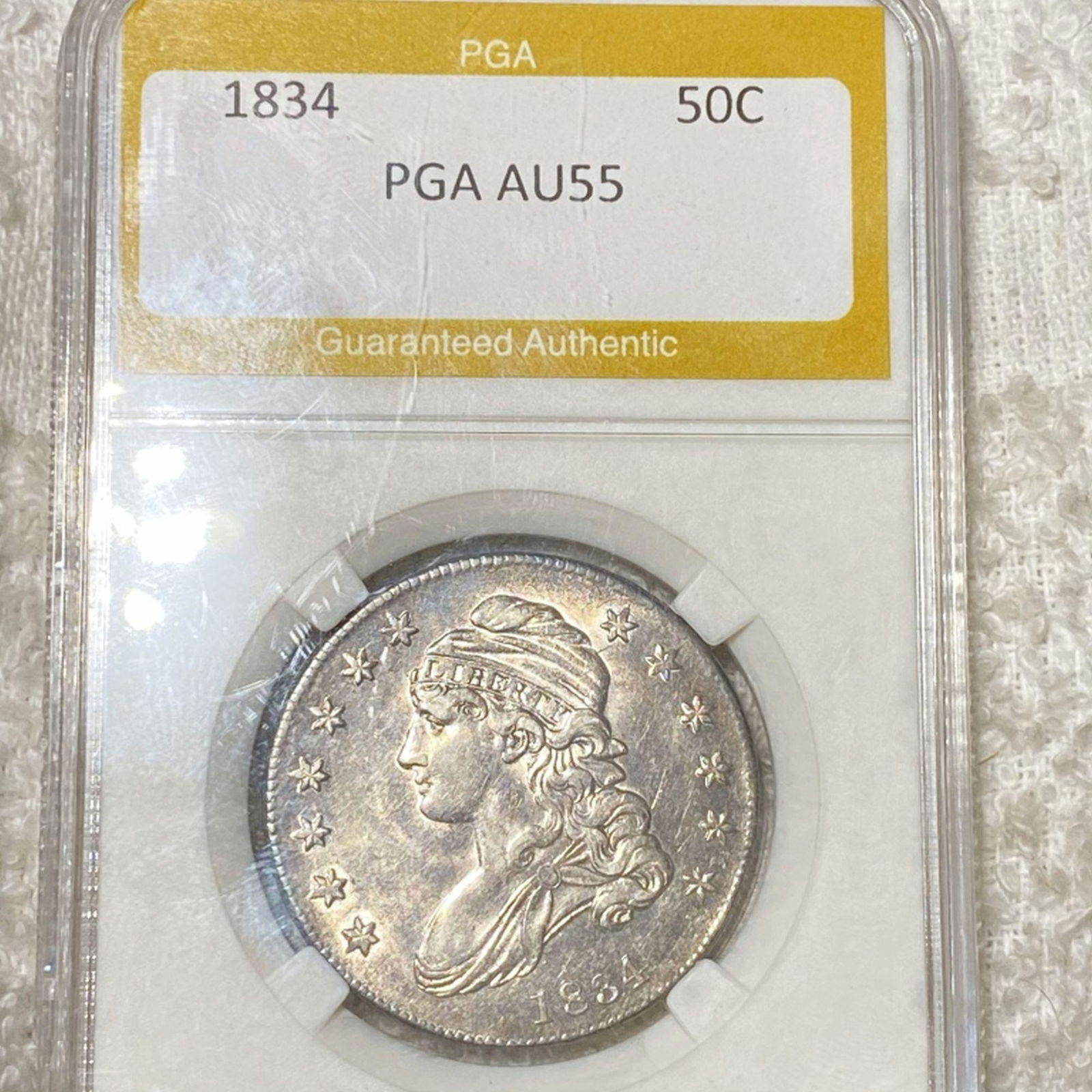 1834 Capped Bust Half Dollar PGA - AU55 (1 of 2)