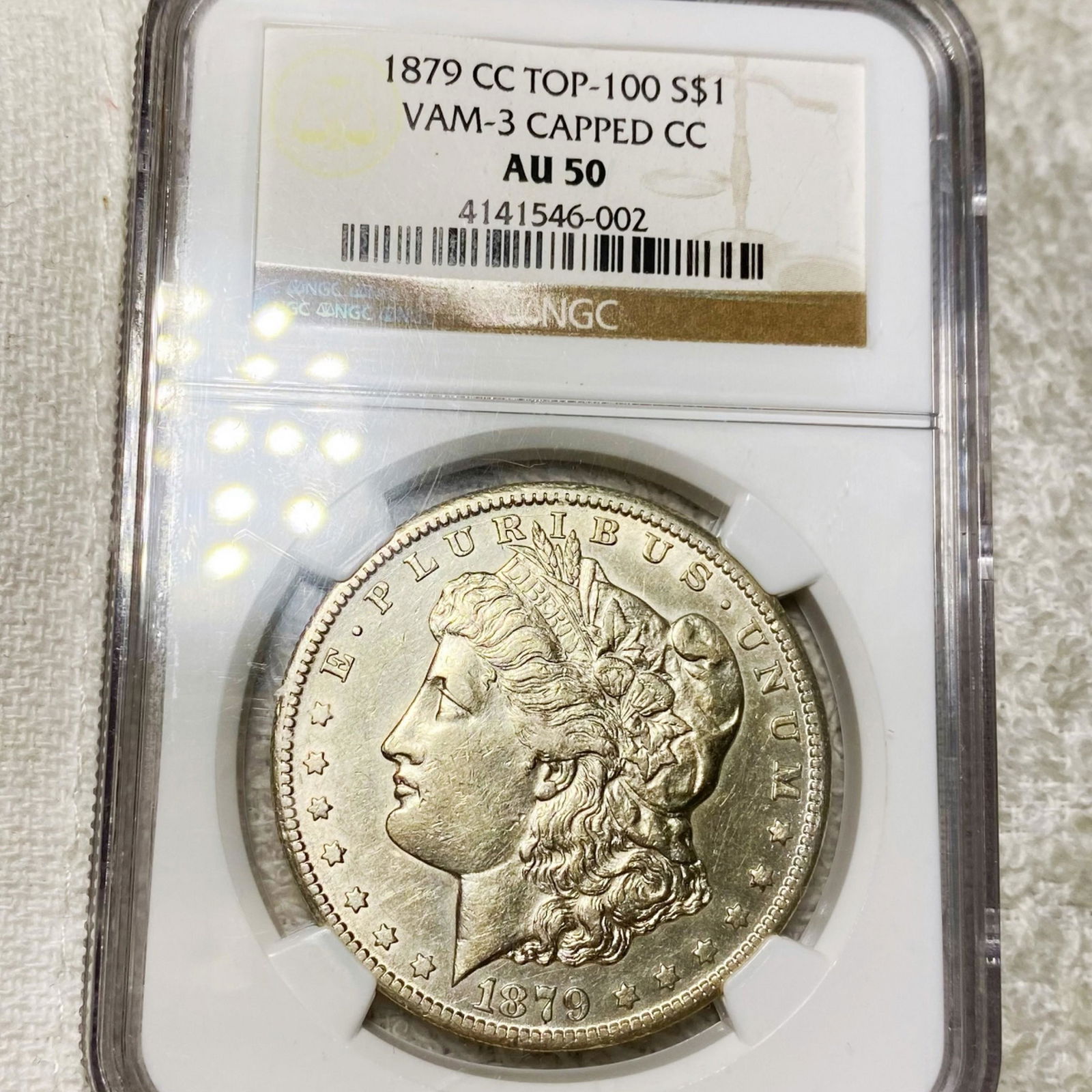 1879-CC Morgan Silver Dollar NGC - AU50 CAPPED CC (1 of 2)