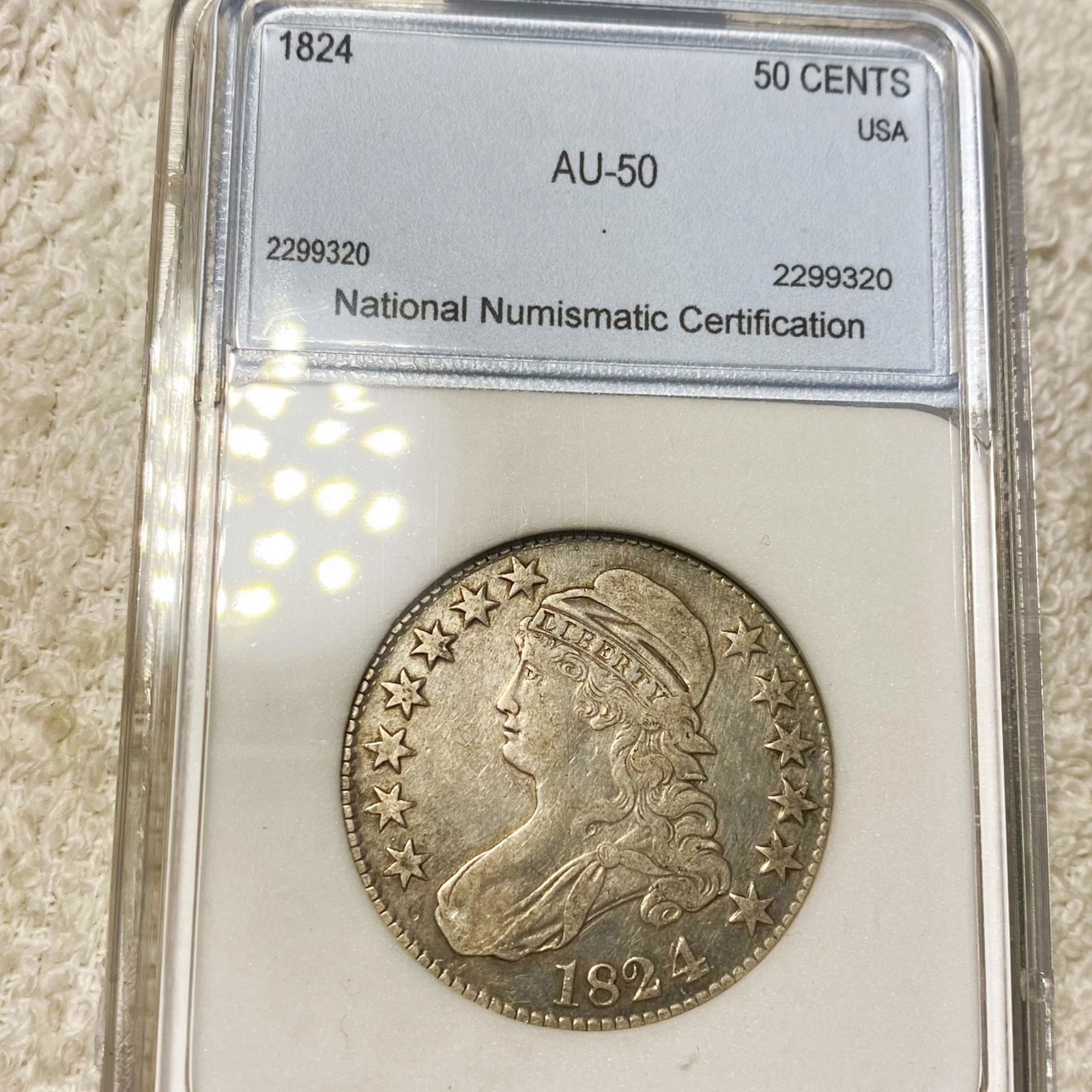 1824 Capped Bust Half Dollar NNC - AU50 (1 of 2)