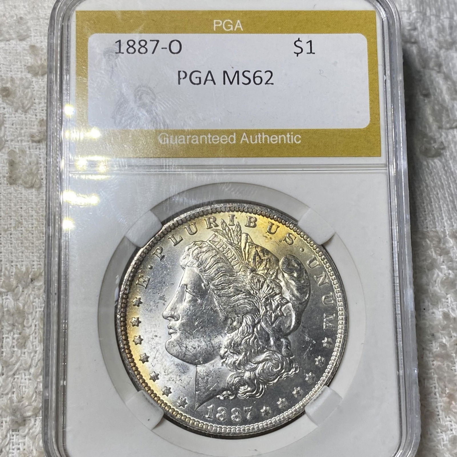 1887-O Morgan Silver Dollar PGA - MS62 (1 of 2)