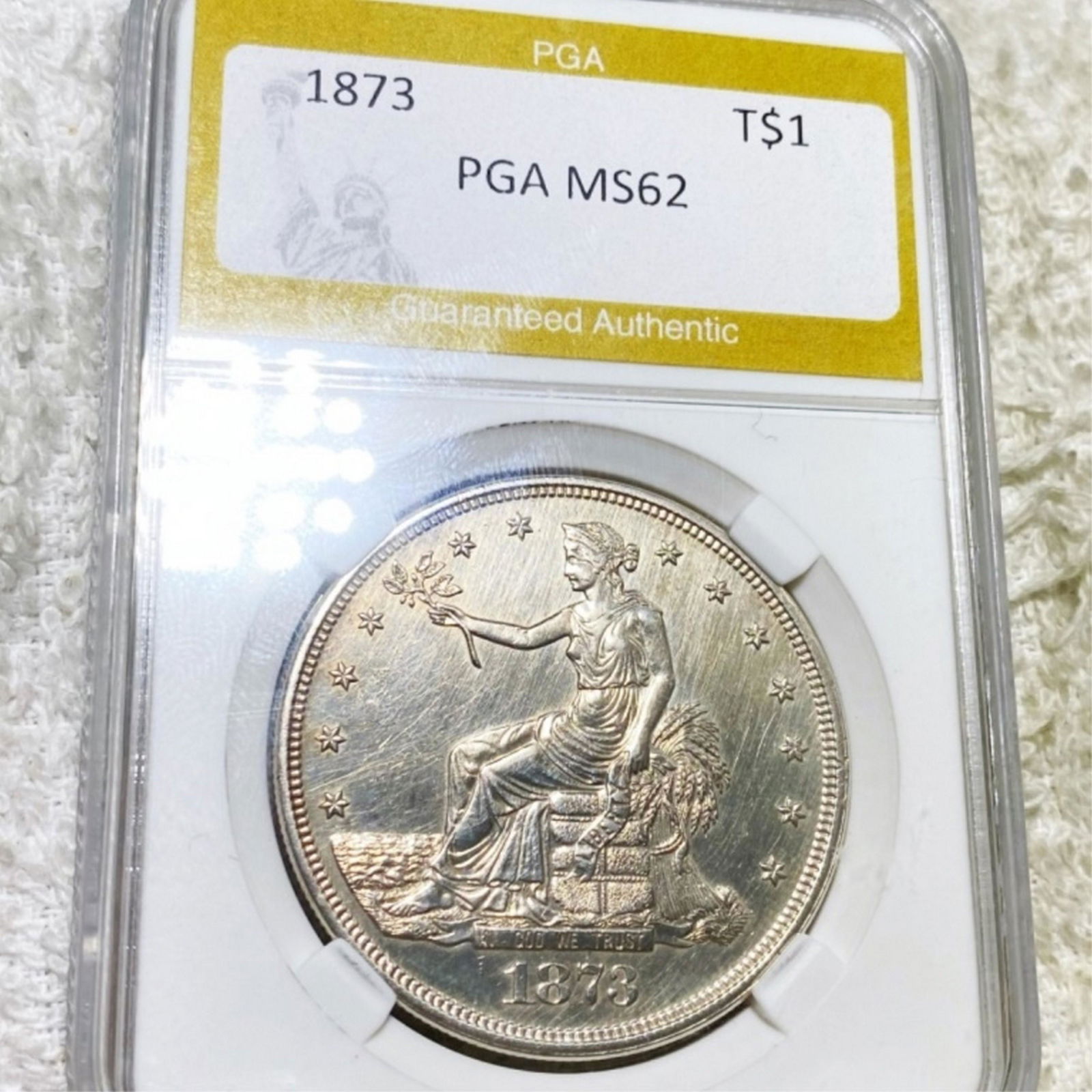 1873 Silver Trade Dollar PGA - MS62 (1 of 2)