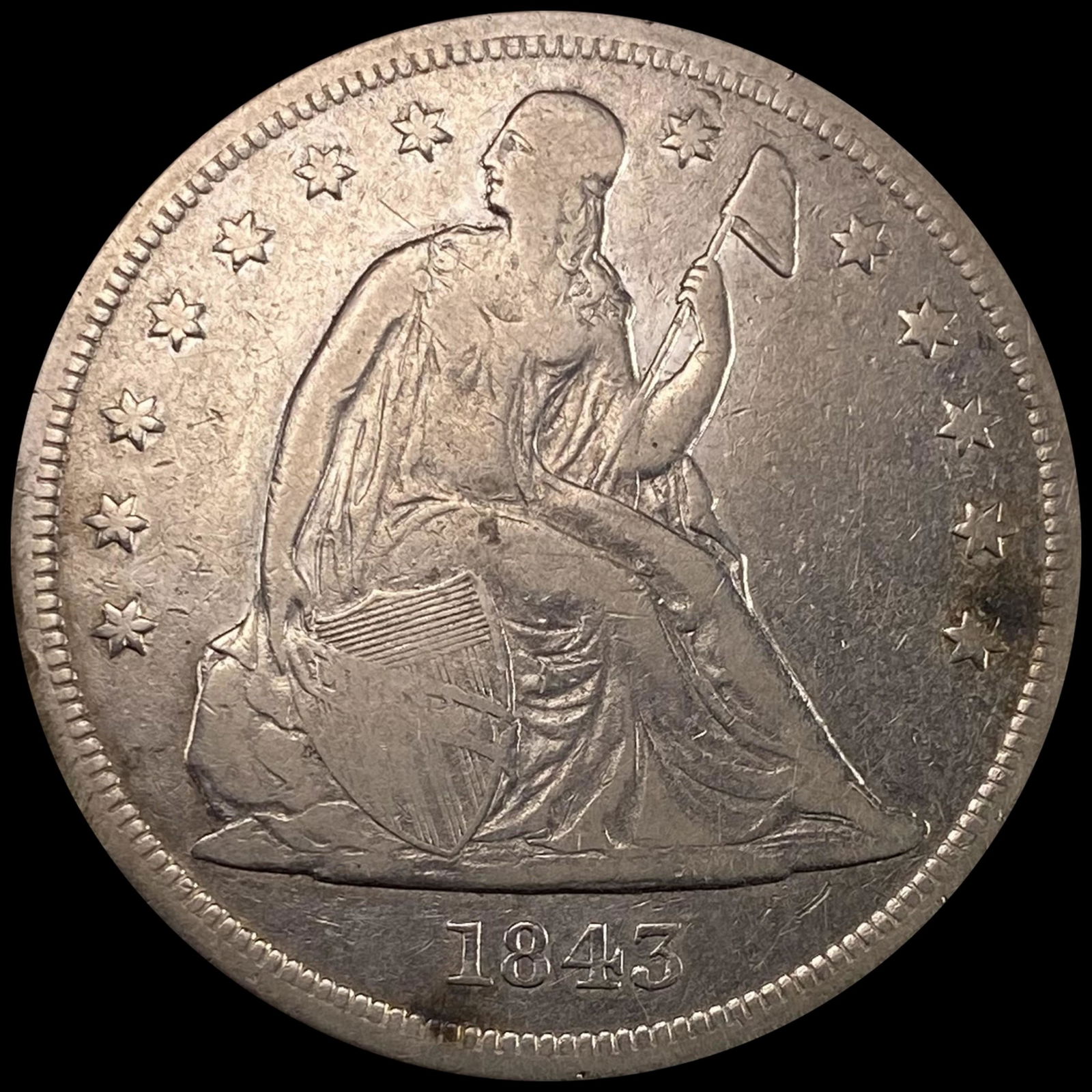 1843 Seated Liberty Dollar NEARLY UNCIRCULATED (1 of 2)