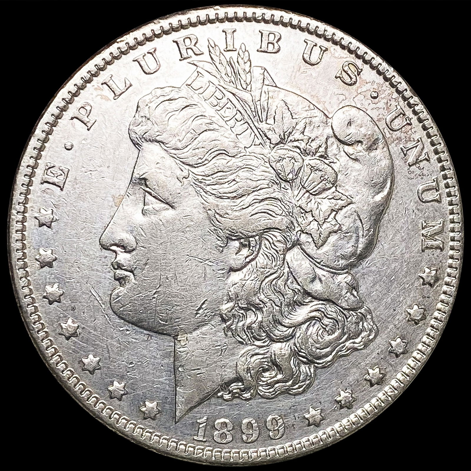 1899 Morgan Silver Dollar CLOSELY UNCIRCULATED (1 of 2)