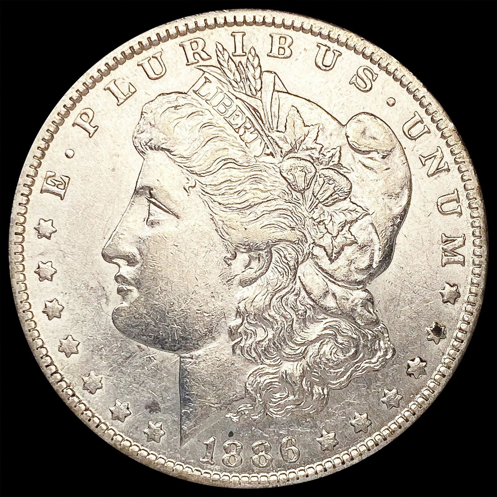 1886-O Morgan Silver Dollar NEARLY UNCIRCULATED (1 of 2)