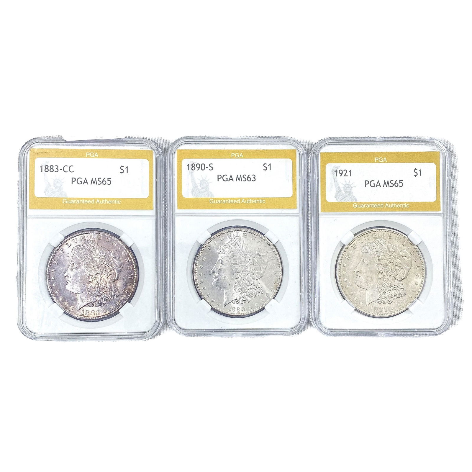 (3) Morgan Silver Dollars PGA MS63-5 (1883-CC, 189 (1 of 2)