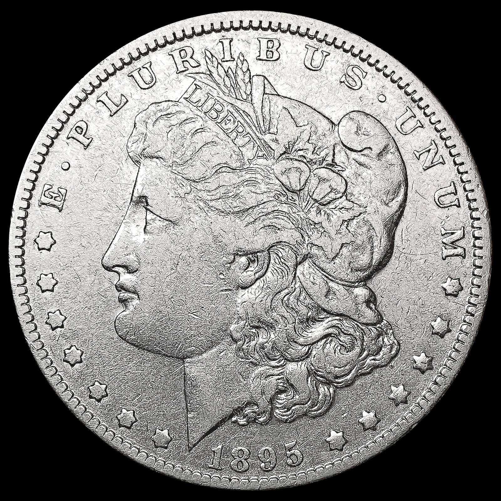 1895-O Morgan Silver Dollar ABOUT UNCIRCULATED: 1895-O Morgan Silver Dollar ABOUT UNCIRCULATED
