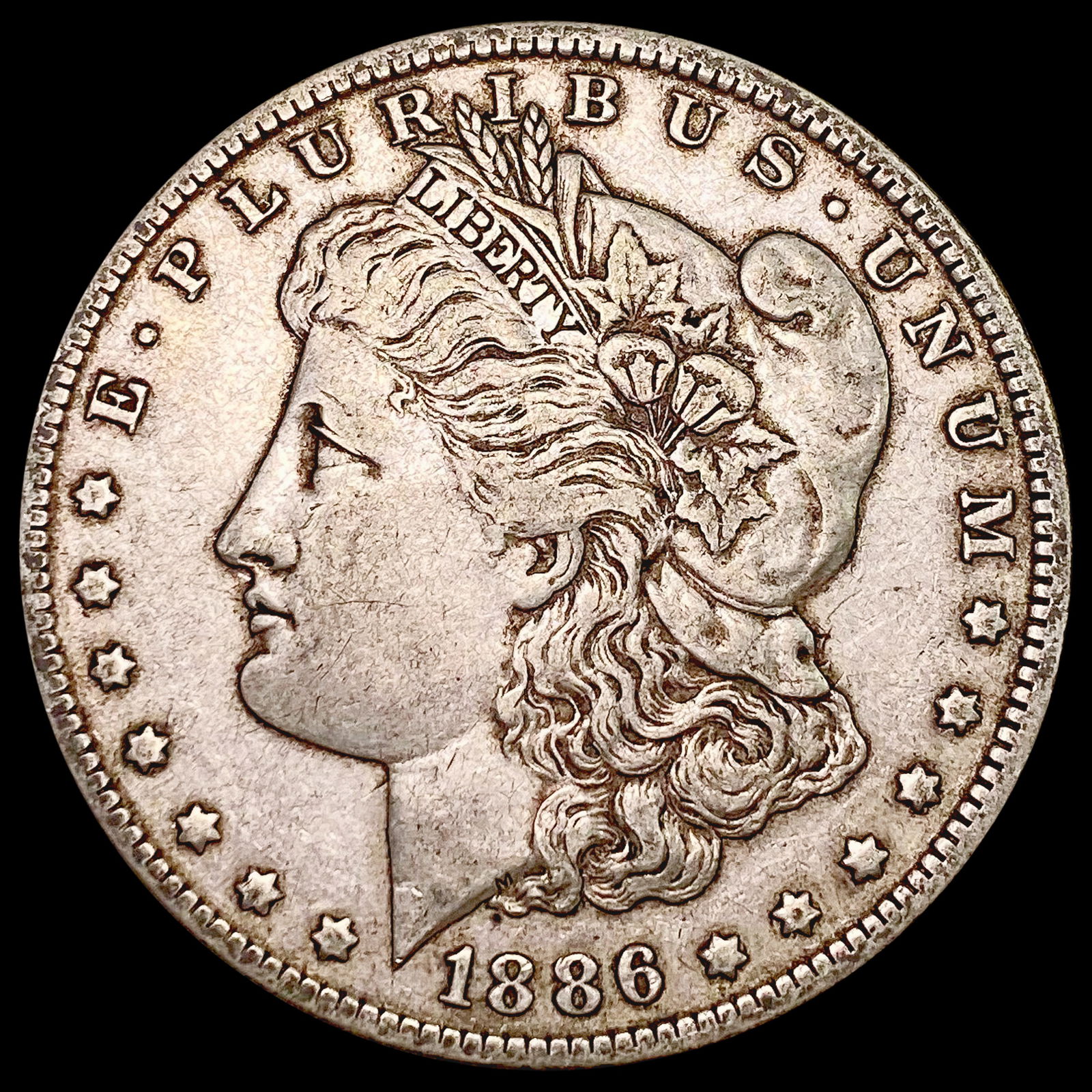 1886-0 Morgan Silver Dollar ABOUT UNCIRCULATED (1 of 2)