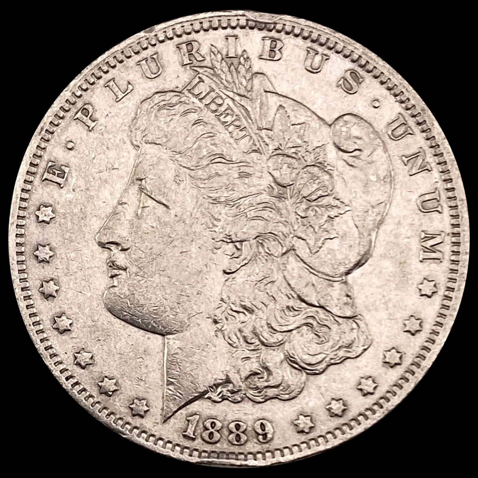 1889-O Morgan Silver Dollar NEARLY UNCIRCULATED (1 of 2)