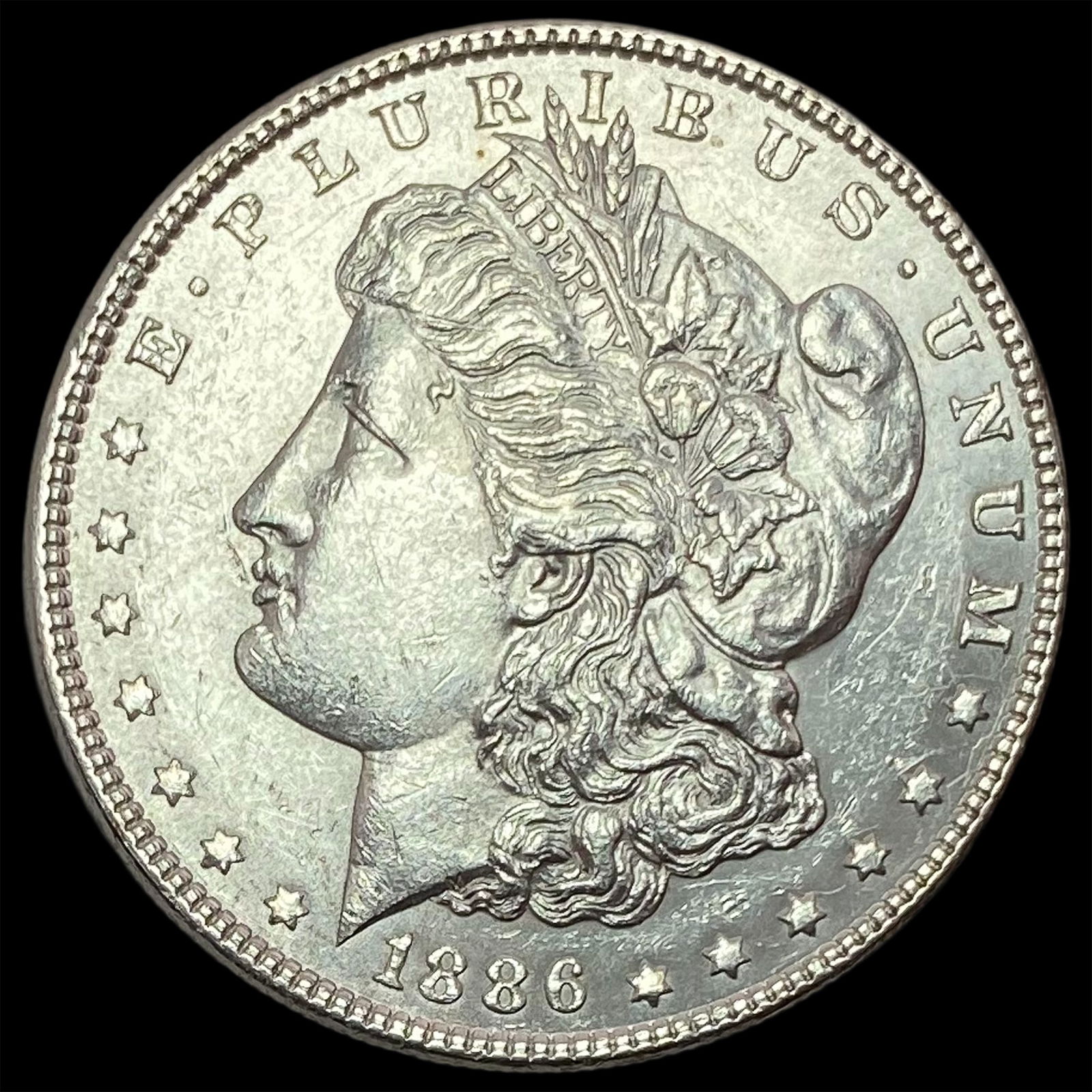 1886 Silver Morgan Dollar ABOUT UNCIRCULATED (1 of 2)