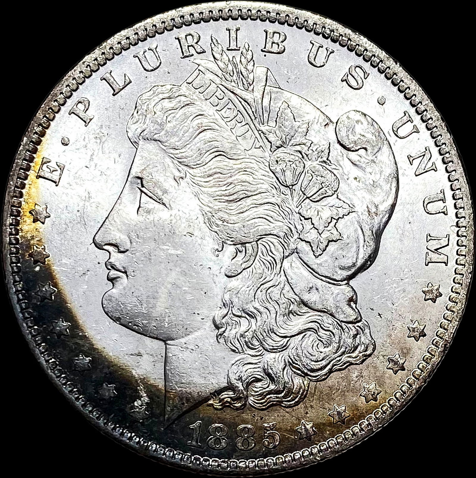 1885-O Toned Silver Morgan Dollar UNC (1 of 2)