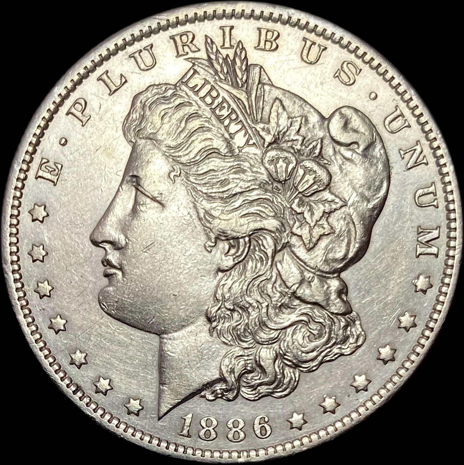 1886-O Silver Morgan Dollar CLOSELY UNCIRCULATED (1 of 2)