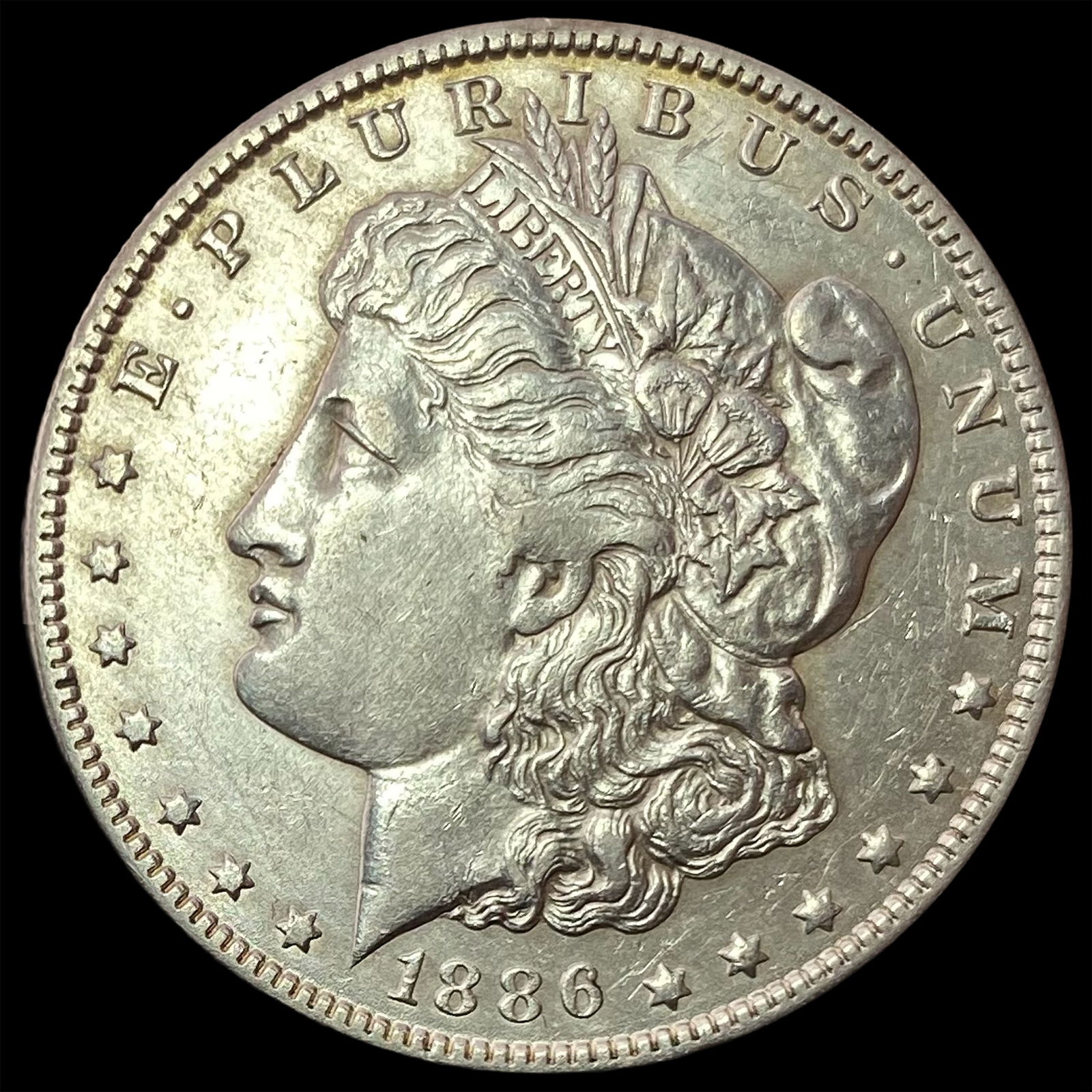 1886-O Silver Morgan Dollar CLOSELY UNCIRCULATED (1 of 2)