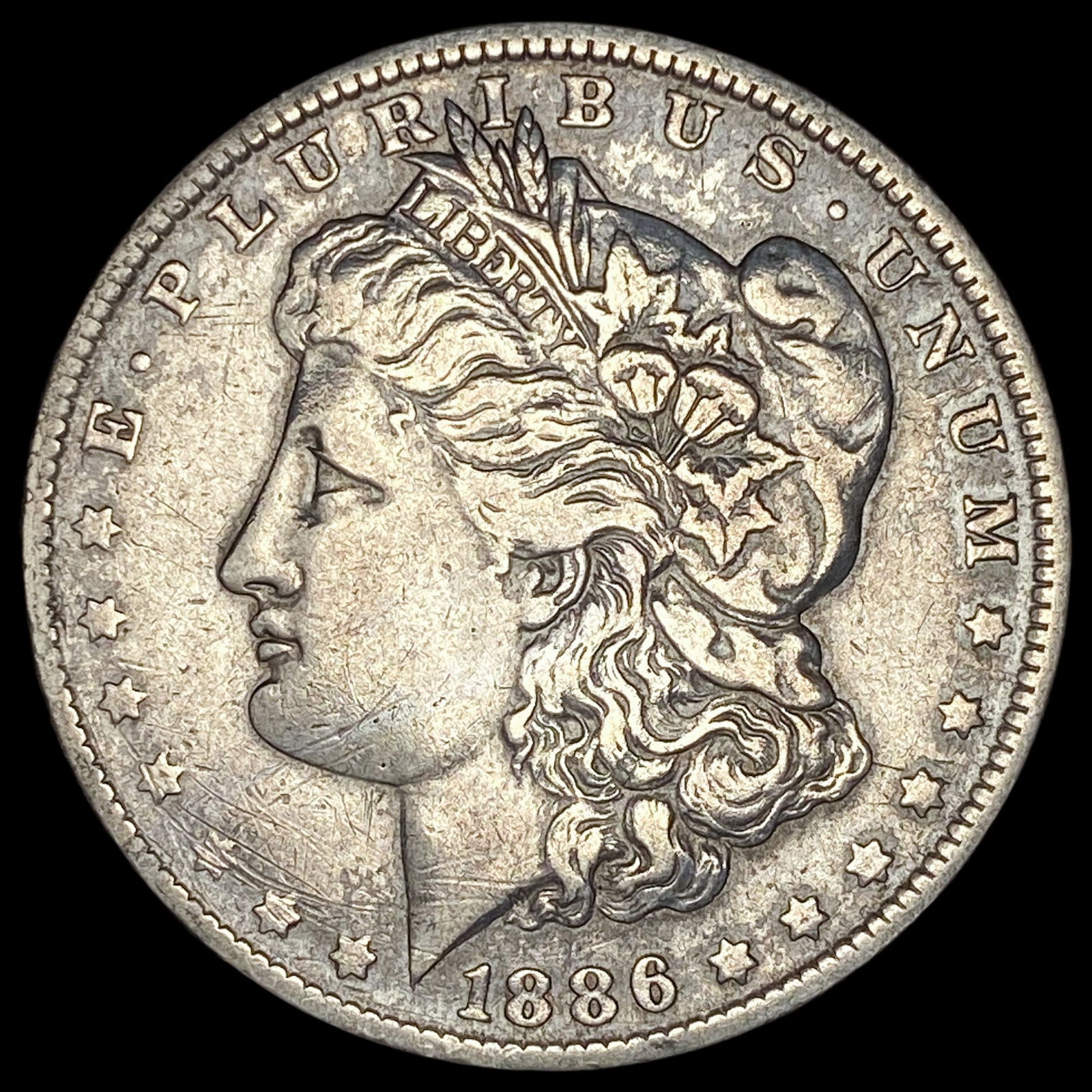 1886-O Silver Morgan Dollar NEARLY UNCIRCULATED (1 of 2)