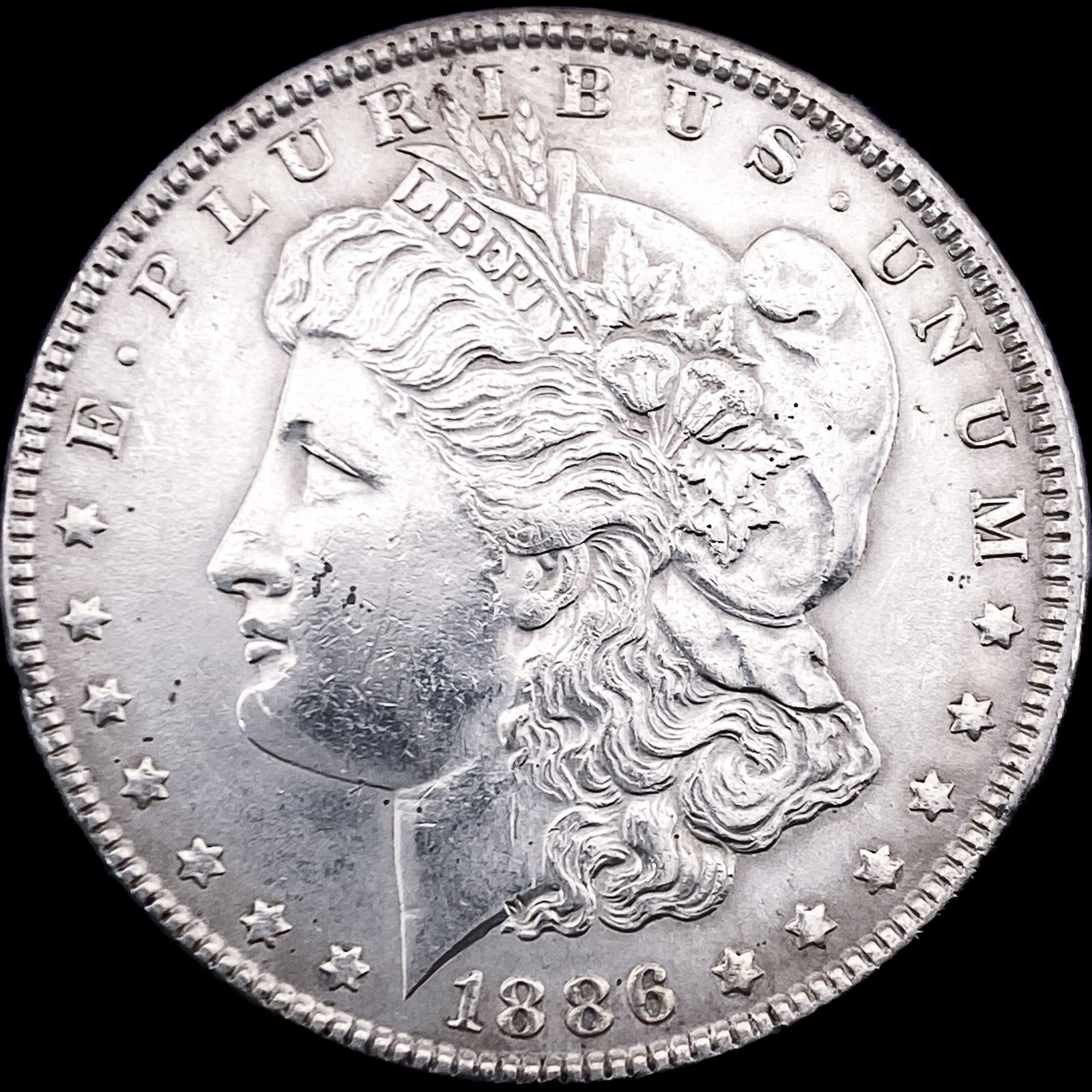 1886 Morgan Silver Dollar CLOSELY UNCIRCULATED (1 of 2)