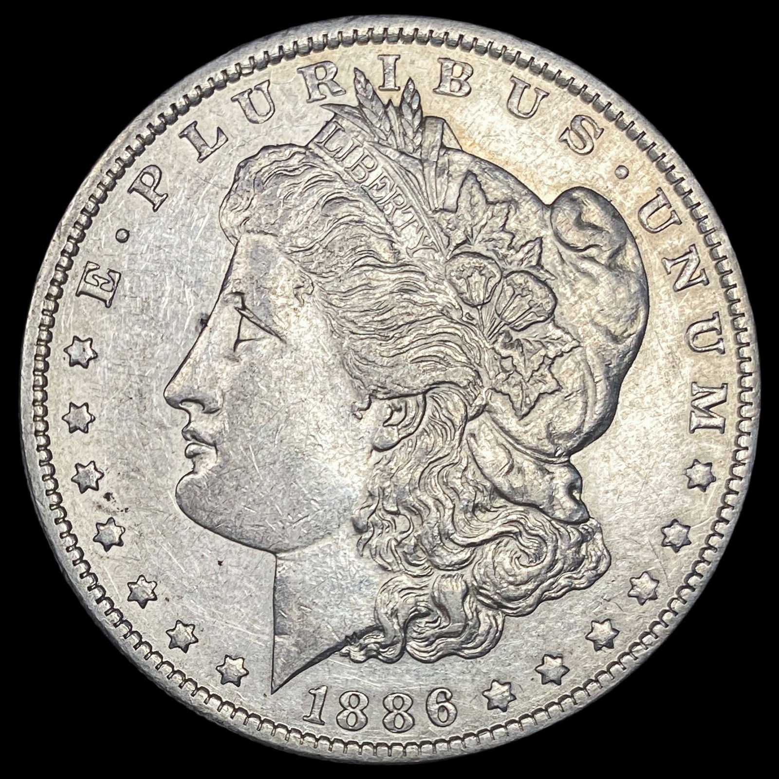 1886-O Silver Morgan Dollar CLOSELY UNCIRCULATED (1 of 2)