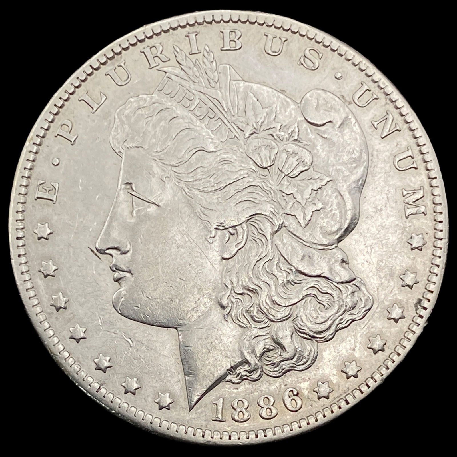 1886-O Silver Morgan Dollar CLOSELY  UNCIRCULATED (1 of 2)
