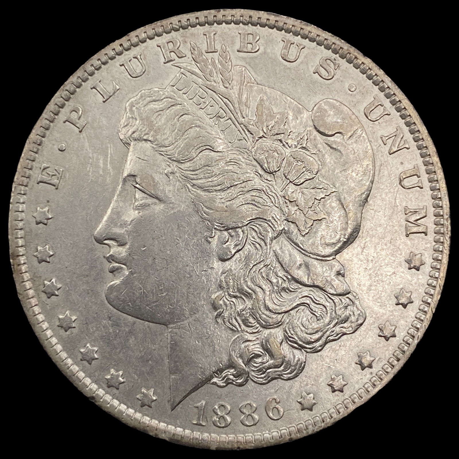 1886-O Silver Morgan Dollar CLOSELY  UNCIRCULATED (1 of 2)