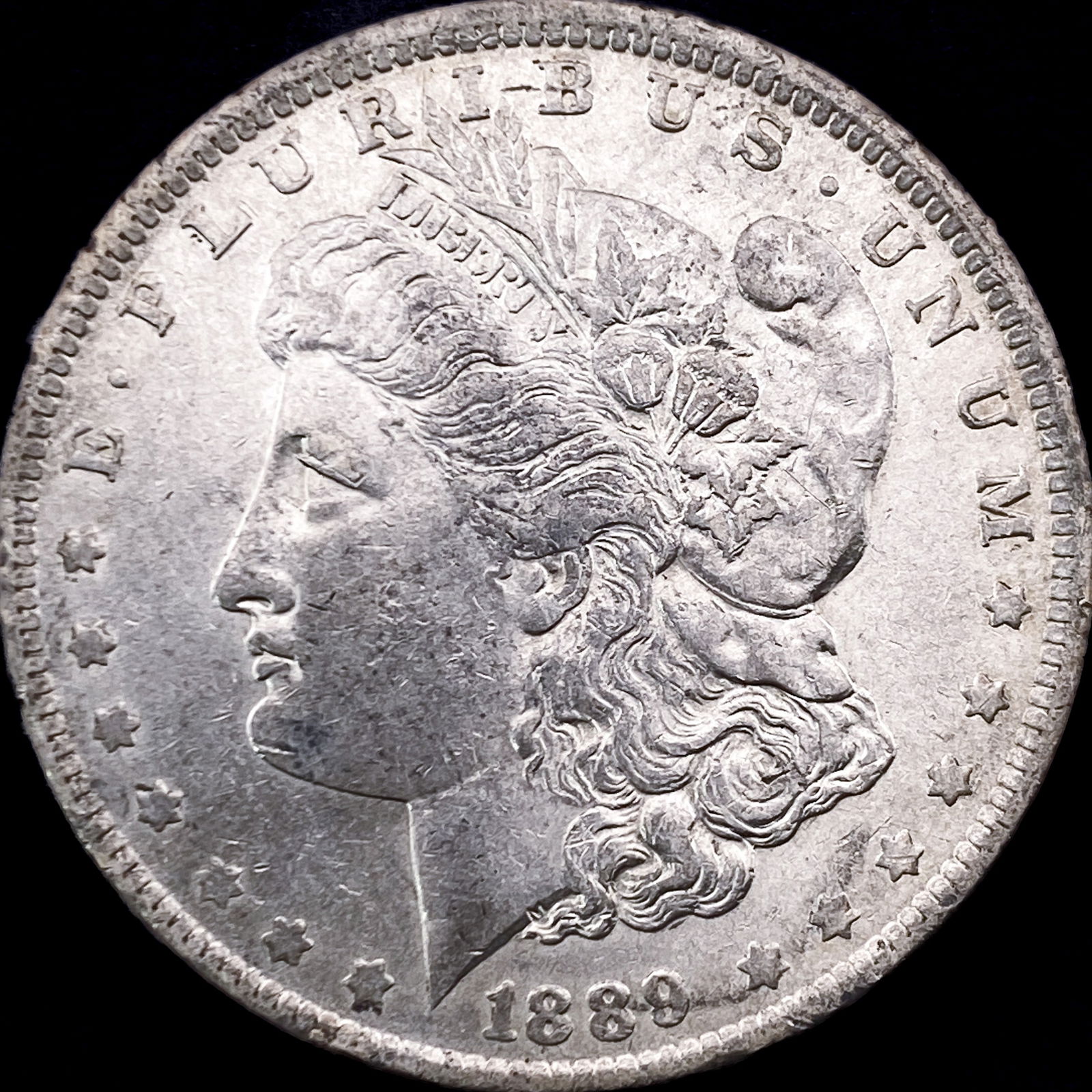 1889-O Morgan Silver Dollar CLOSELY UNCIRCULATED (1 of 2)