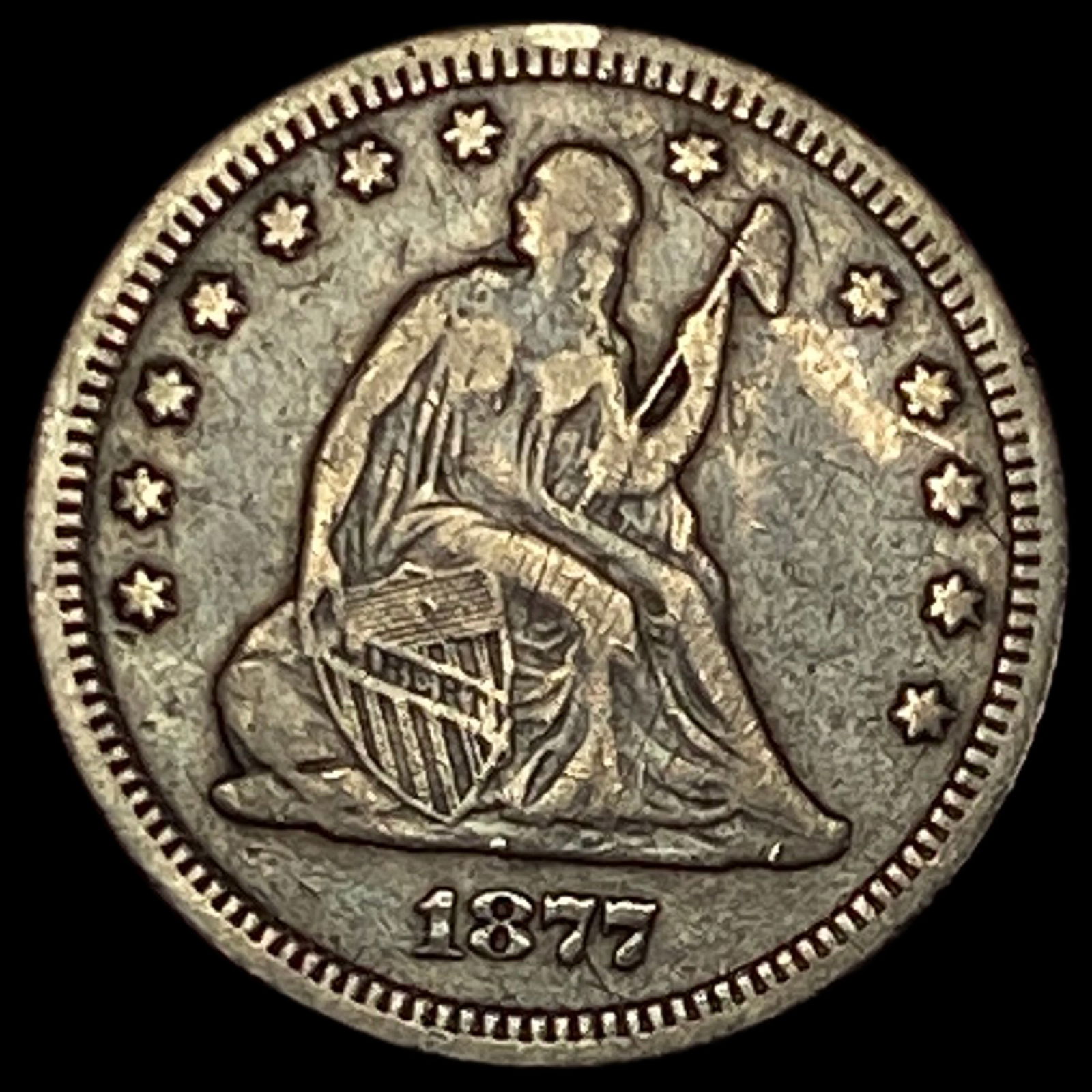 1877 Seated Liberty Quarter ABOUT UNCIRCULATED (1 of 2)