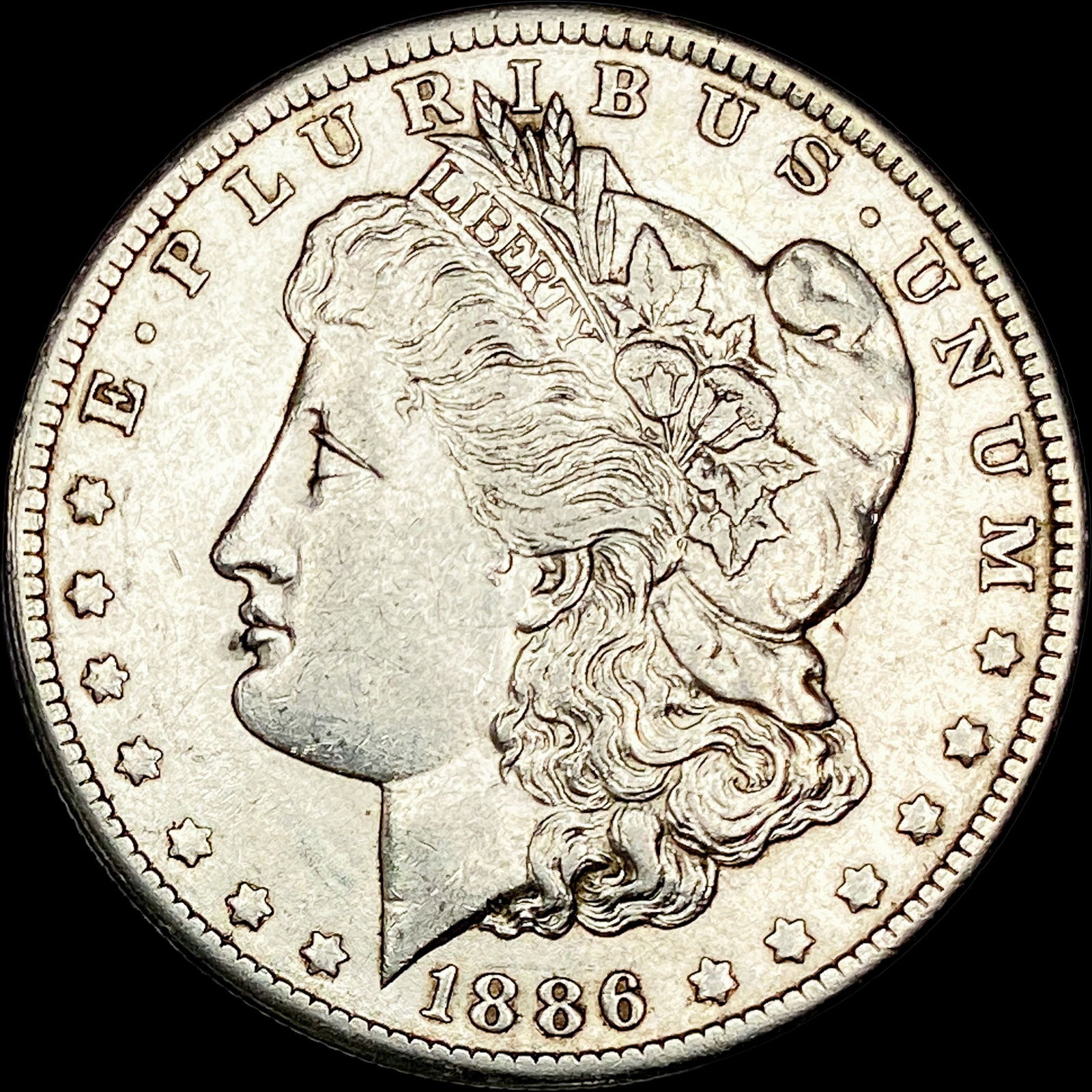 1886 Morgan Silver Dollar CLOSELY UNCIRCULATED (1 of 2)