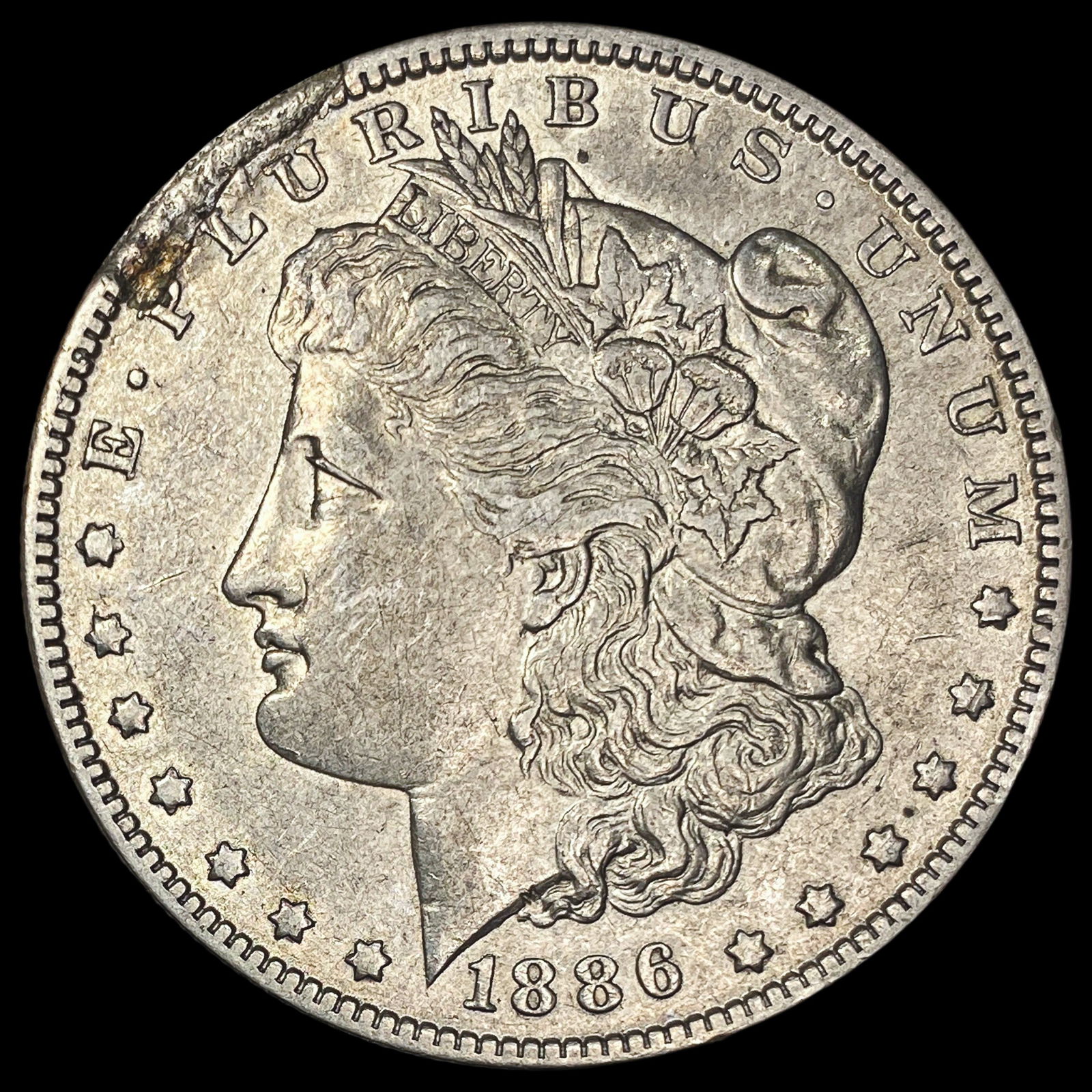 1886-O Silver Morgan Dollar CLOSELY UNCIRCULATED (1 of 2)