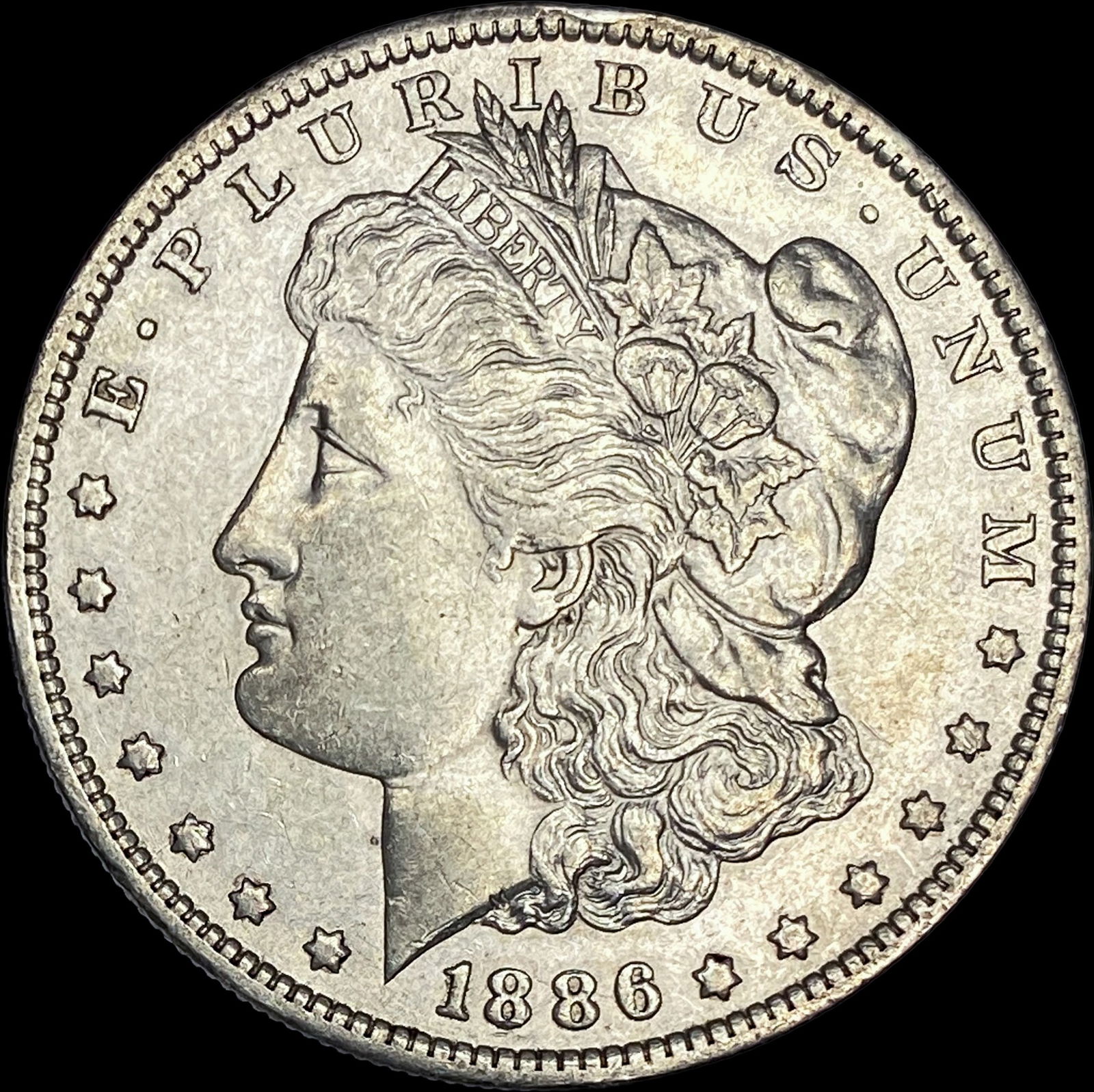 1886 Silver Morgan Dollar CLOSELY UNCIRCULATED (1 of 2)