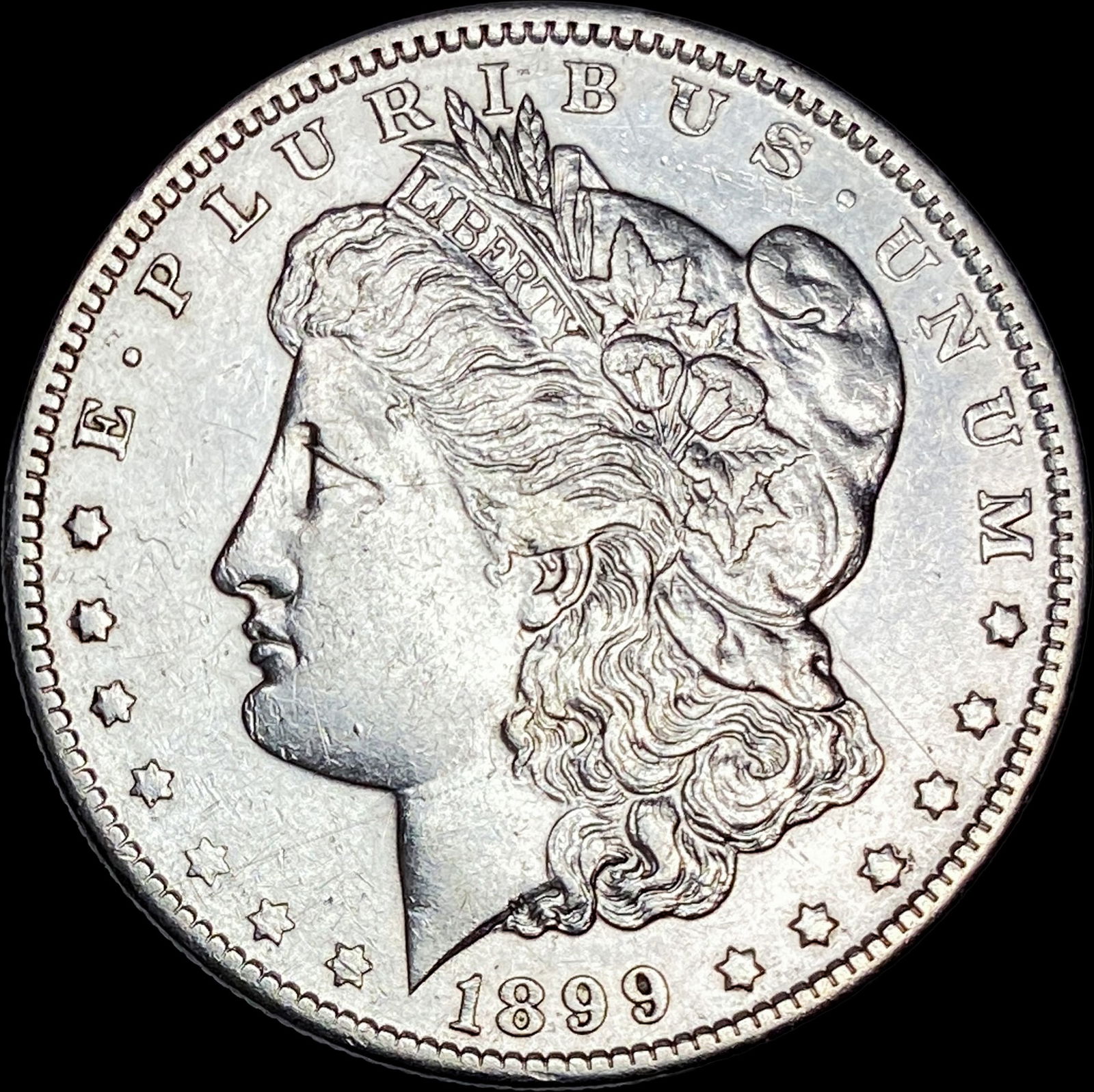 1899 Morgan Silver Dollar CLOSELY UNCIRCULATED (1 of 2)