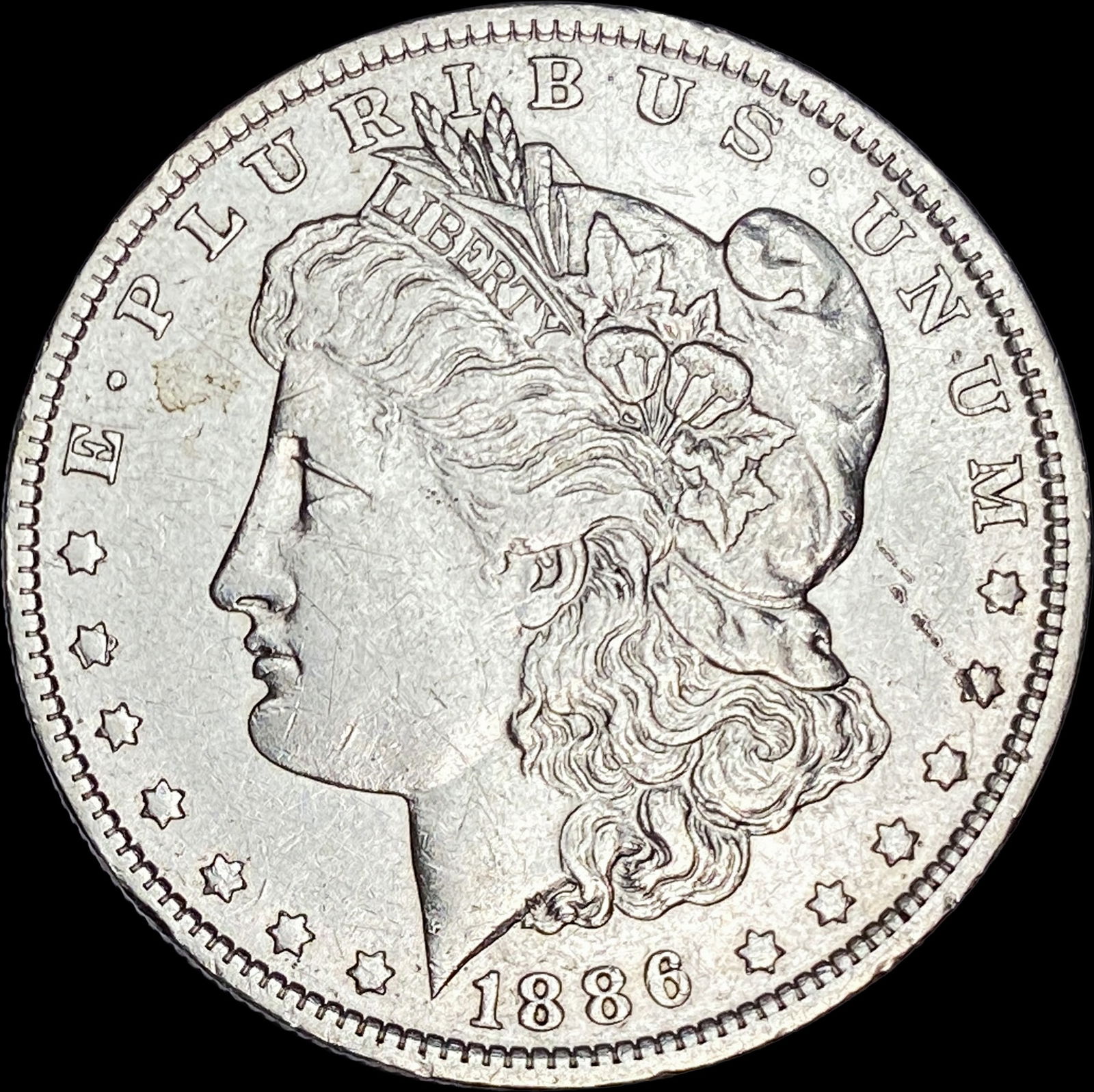 1886-O Silver Morgan Dollar CLOSELY UNCIRCULATED (1 of 2)
