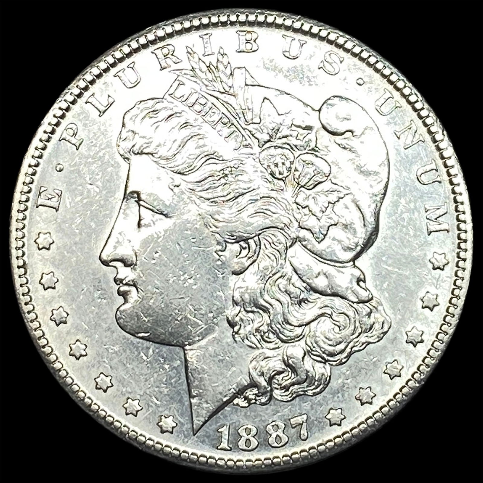 1887 Morgan Silver Dollar CLOSELY UNCIRCULATED (1 of 2)