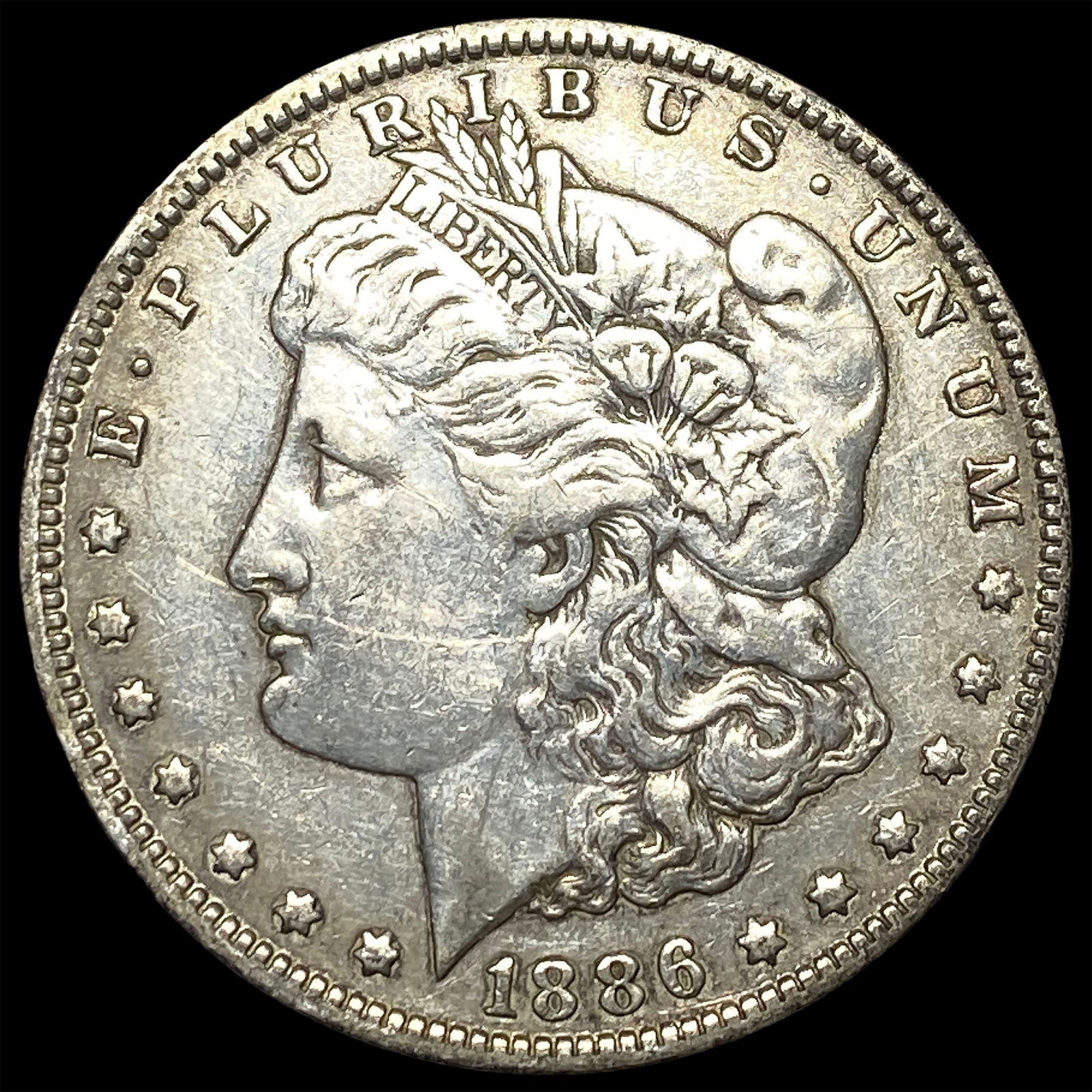 1886-O Silver Morgan Dollar NEARLY UNCIRCULATED (1 of 2)