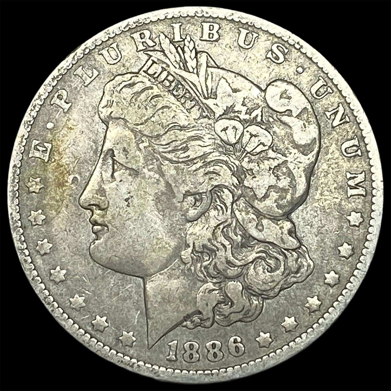 1886-O Silver Morgan Dollar ABOUT UNCIRCULATED: 1886-O Silver Morgan Dollar ABOUT UNCIRCULATED