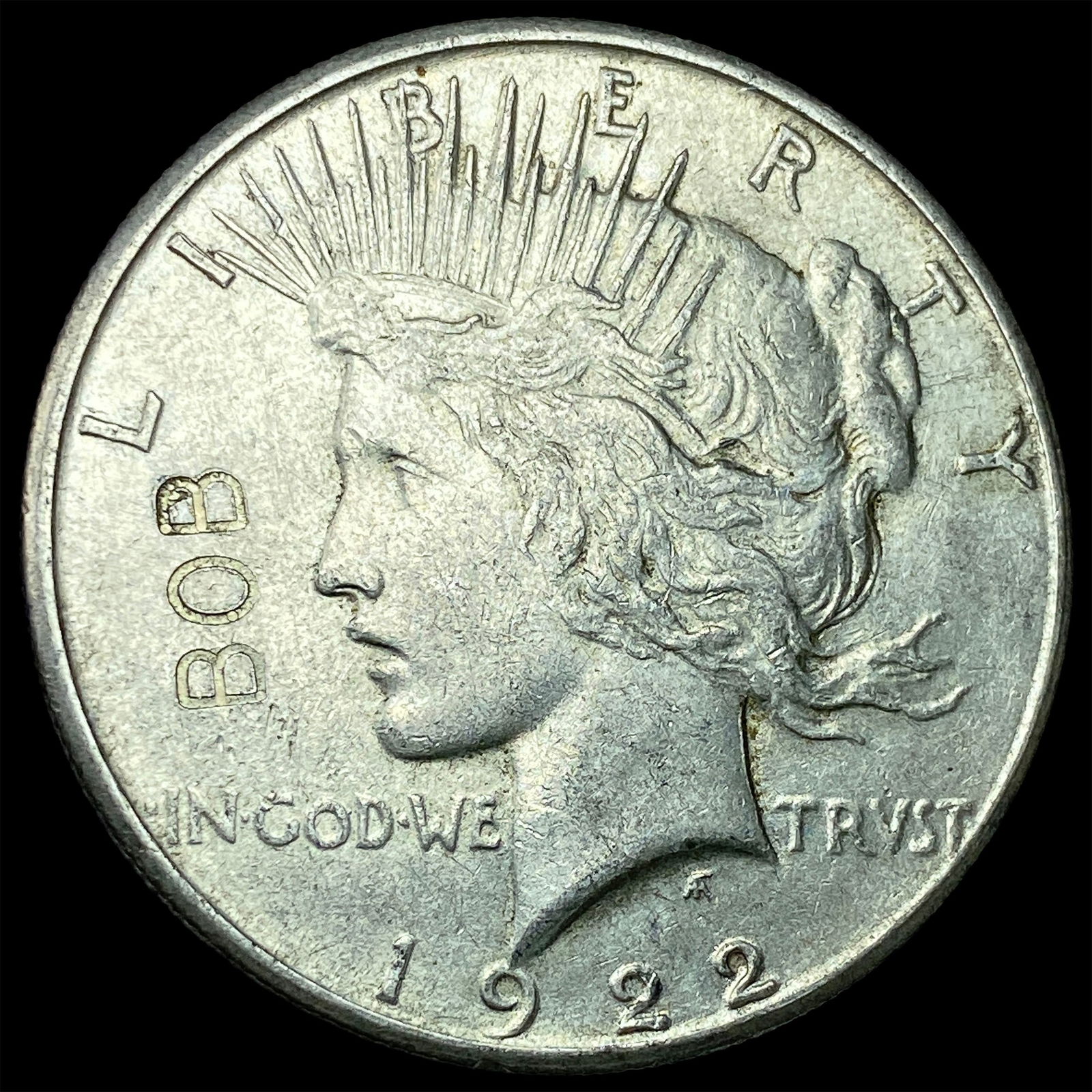 This is a novelty altered 1922 Peace Dollar. HIGH GRADE: This is a novelty altered 1922 Peace Dollar. HIGH GRADE