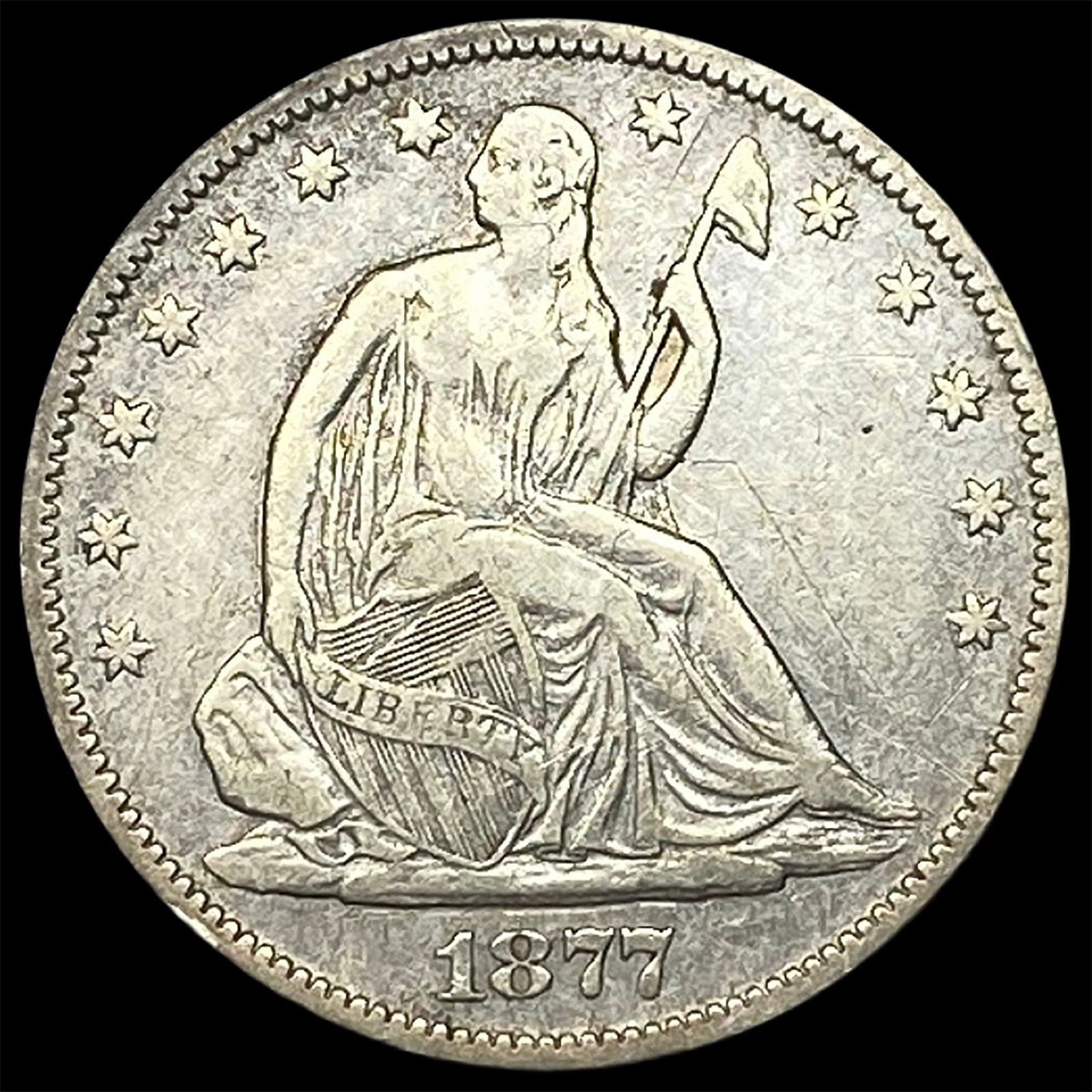 1877-S Silver Seated Liberty Half Dollar ABOUT UNCIRCULATED: 1877-S Silver Seated Liberty Half Dollar ABOUT UNCIRCULATED