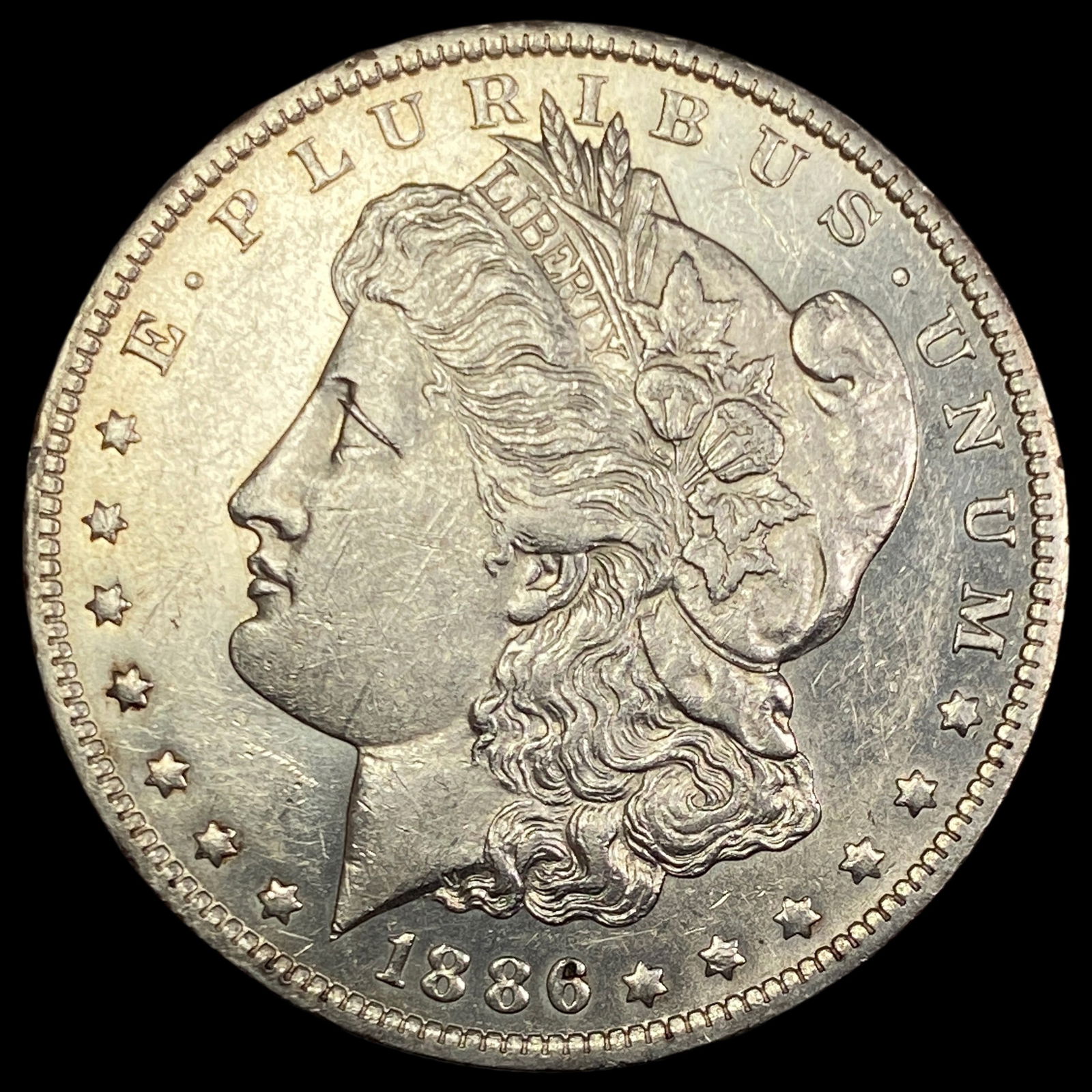1886-O Silver Morgan Dollar CLOSELY UNCIRCULATED (1 of 2)