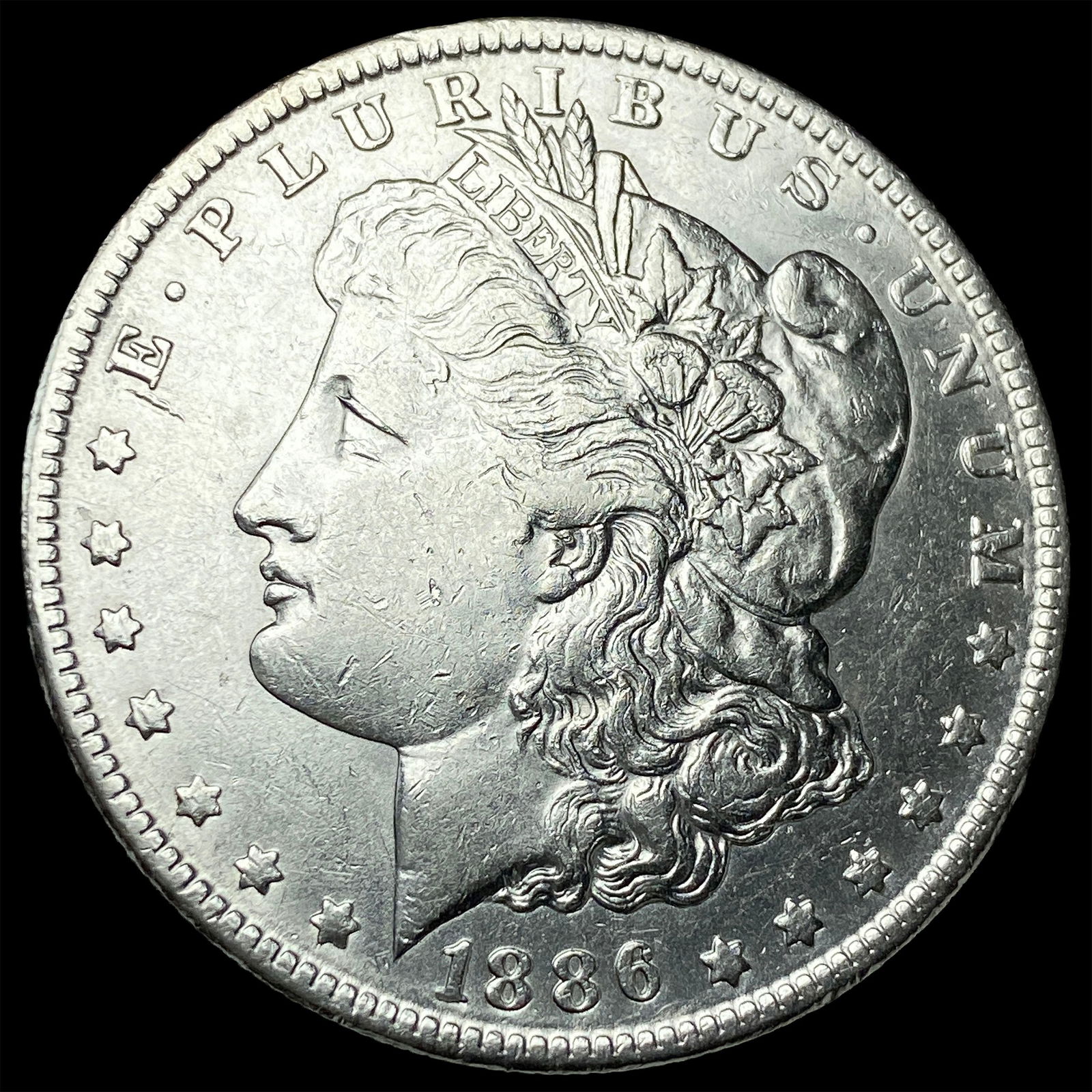 1886-O Silver Morgan Dollar CLOSELY UNCIRCULATED (1 of 2)