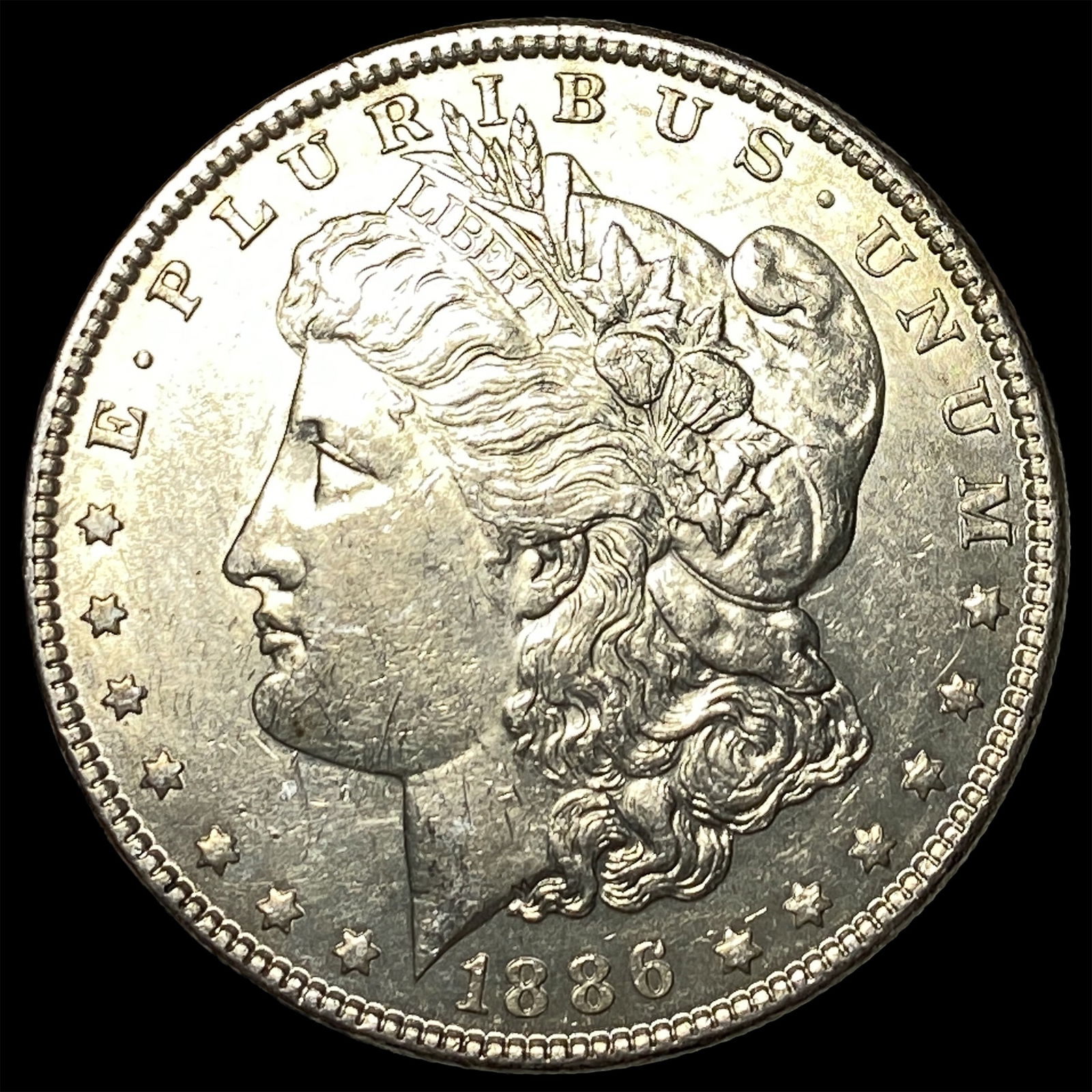 1886 Morgan Silver Dollar CLOSELY UNCIRCULATED (1 of 2)