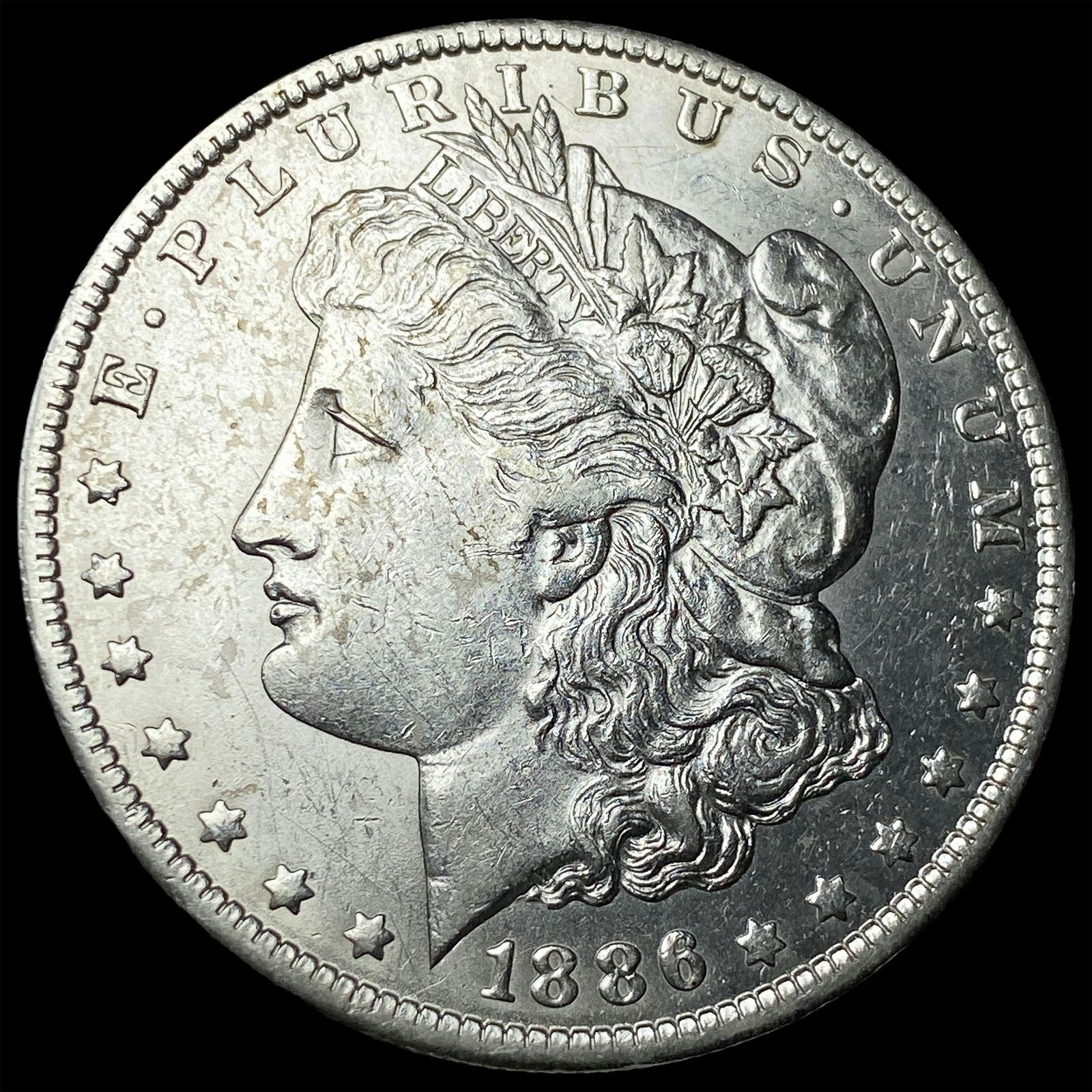 1886-O Silver Morgan Dollar CLOSELY UNCIRCULATED (1 of 2)