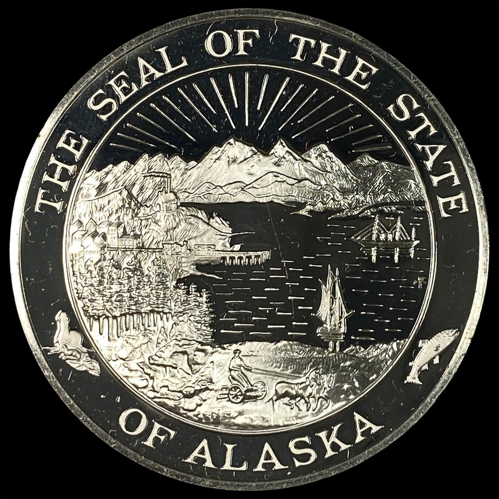 This is a silver round featuring the Seal of the State of Alaska not an official coin. CLOSELY: This is a silver round featuring the Seal of the State of Alaska not an official coin. CLOSELY UNCIRCULATED