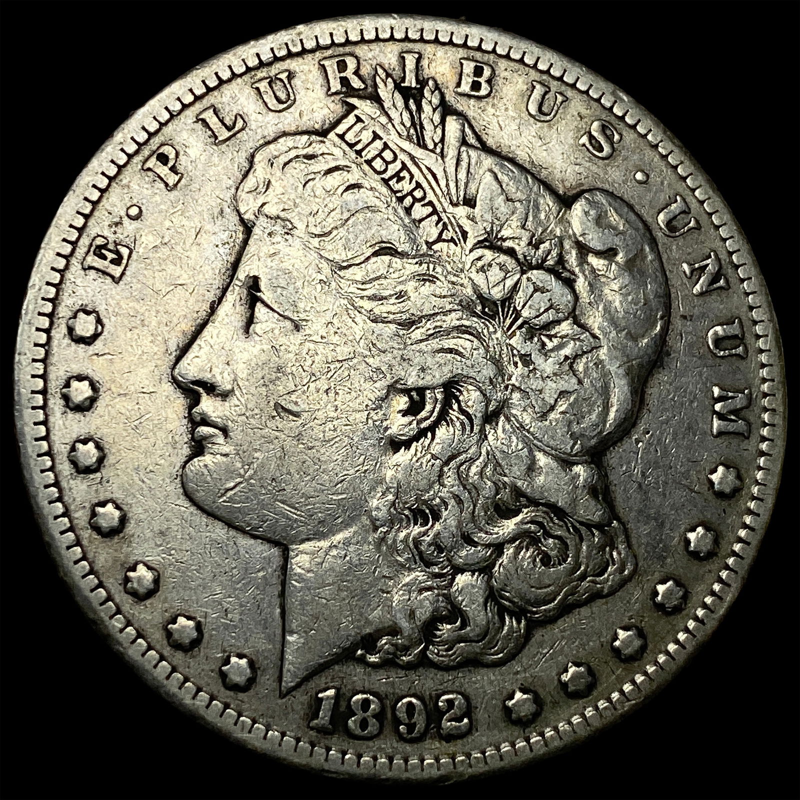 1892-CC Silver Morgan Dollar ABOUT UNCIRCULATED: 1892-CC Silver Morgan Dollar ABOUT UNCIRCULATED