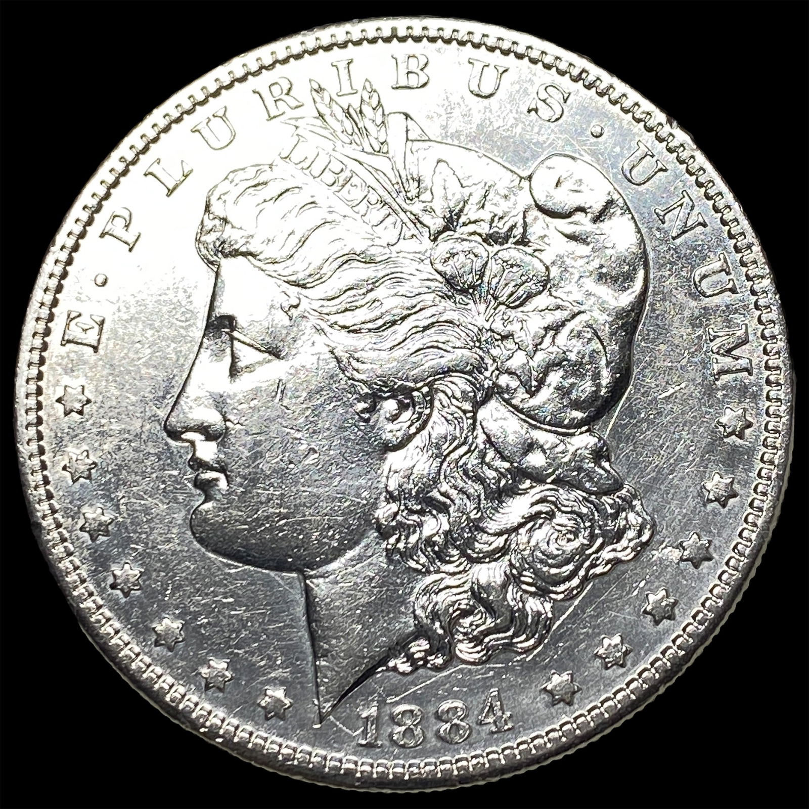 1884 Morgan Silver Dollar CLOSELY UNCIRCULATED (1 of 2)