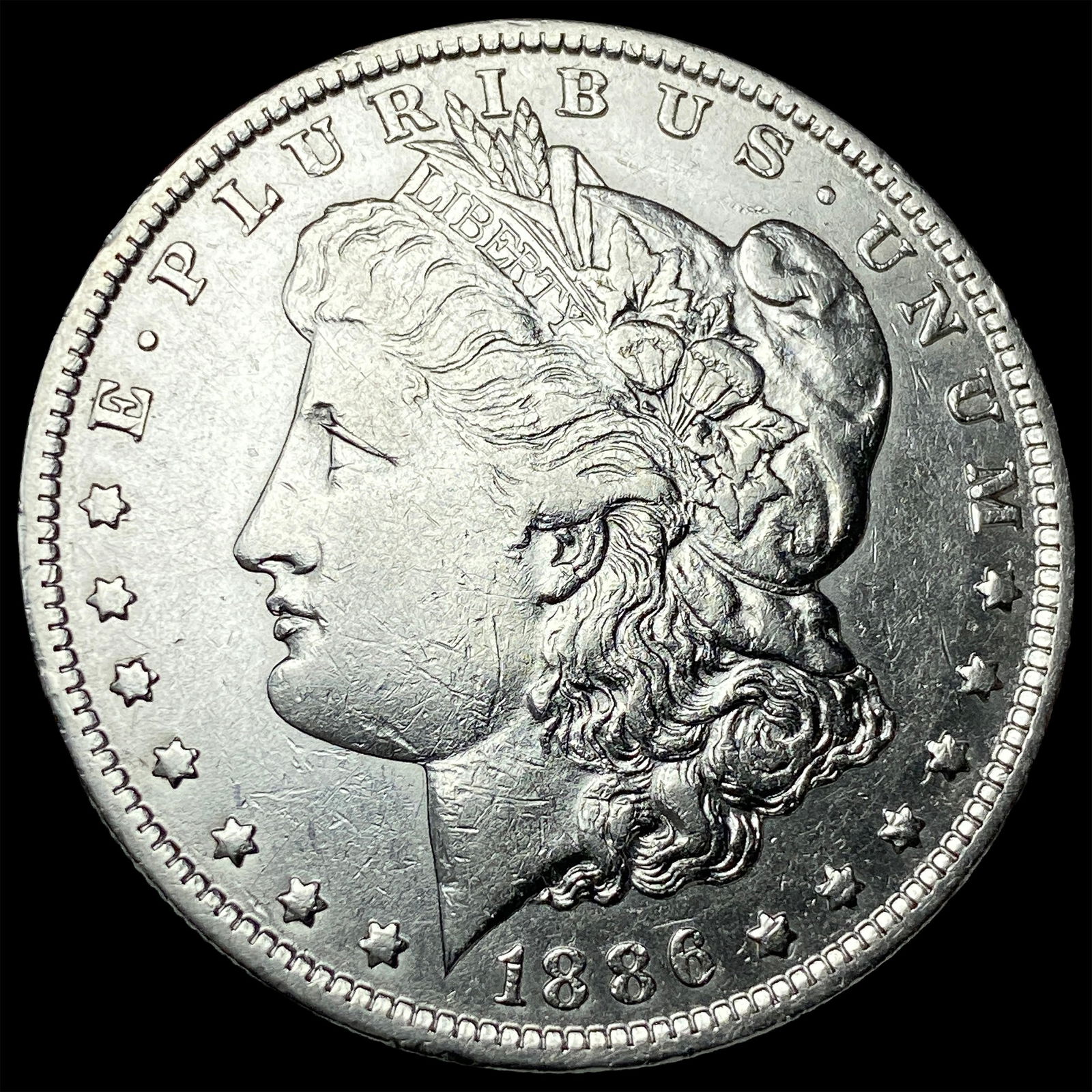1886-O Silver Morgan Dollar CLOSELY UNCIRCULATED (1 of 2)