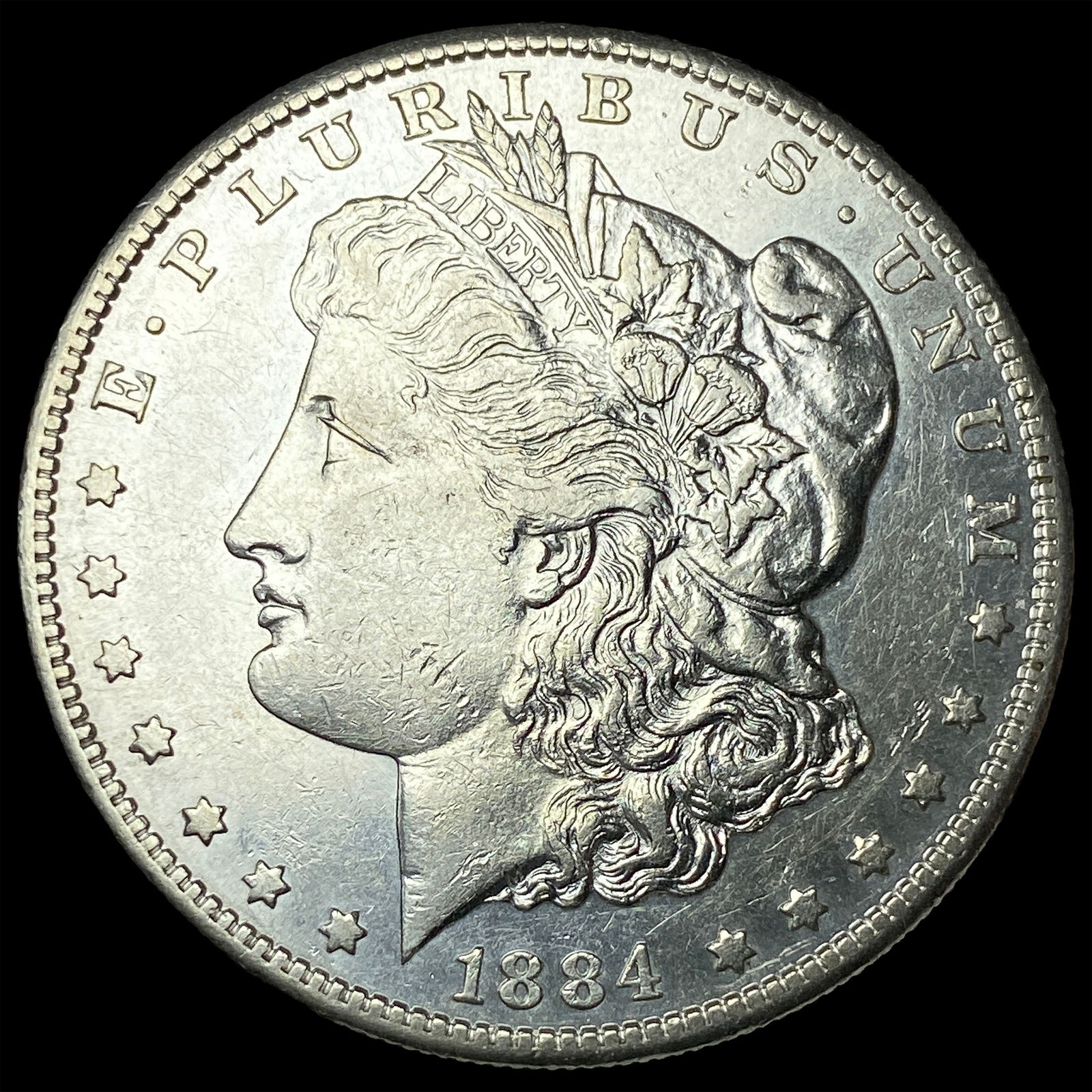 1884 Morgan Silver Dollar CLOSELY UNCIRCULATED (1 of 2)