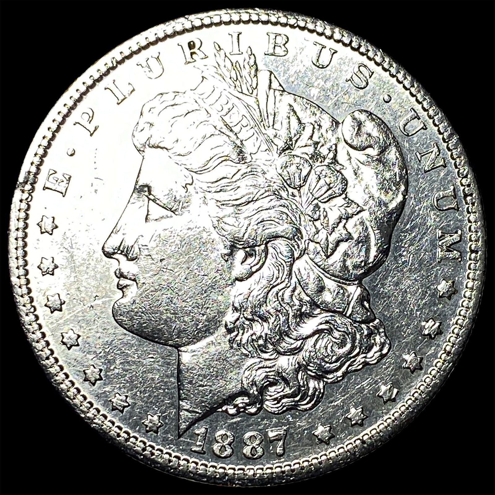 1887 Morgan Silver Dollar CLOSELY UNCIRCULATED (1 of 2)