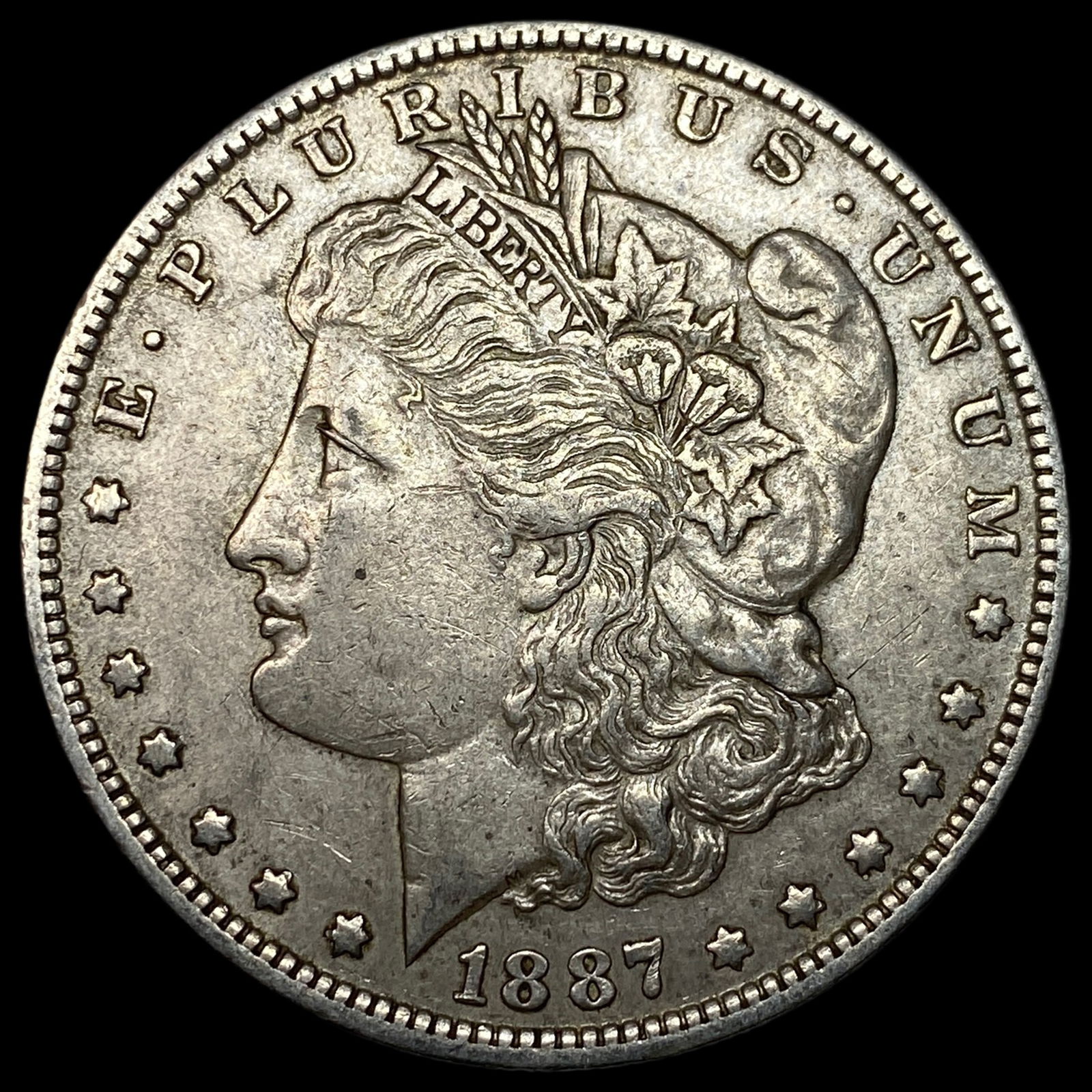 1887-O Silver Morgan Dollar CLOSELY UNCIRCULATED (1 of 2)