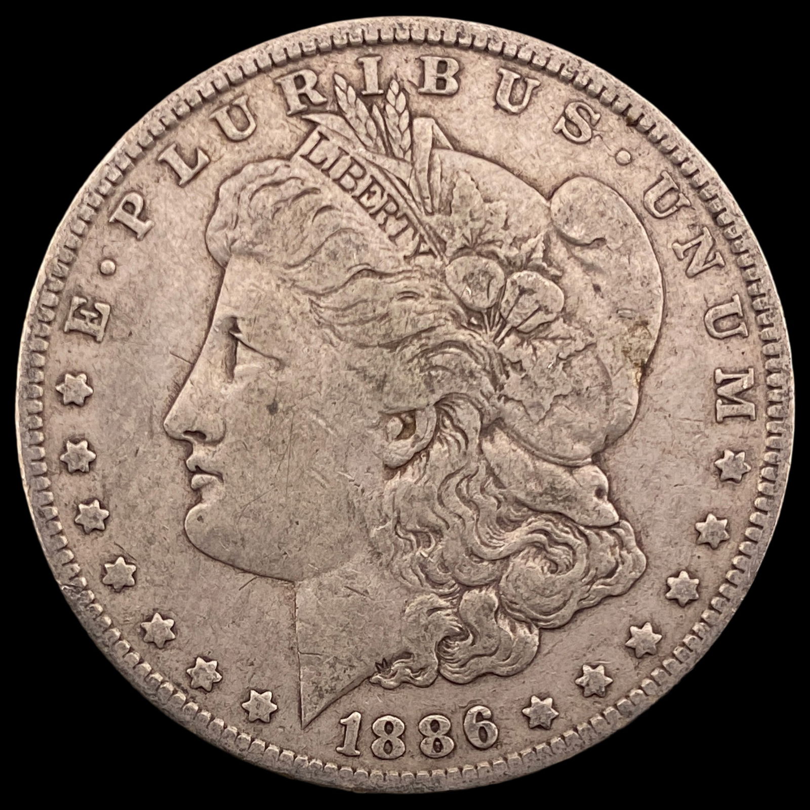 1886-O Silver Morgan Dollar ABOUT UNCIRCULATED (1 of 2)