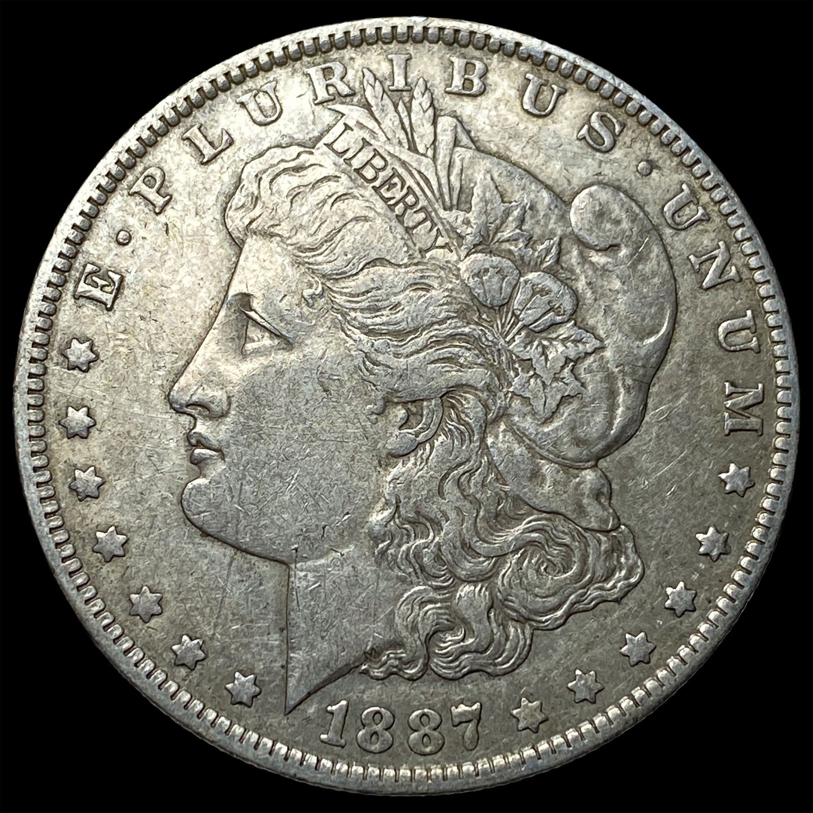 1887-O Silver Morgan Dollar CLOSELY UNCIRCULATED (1 of 2)